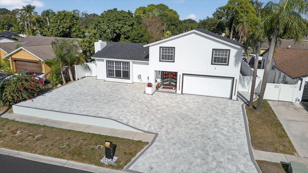 Photo of 7613 Rustic Dr, Tampa, FL 33634 (MLS # TB8480992)