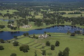 Build your dream home, horse ranch, in the same neighborhood as the 2024 Kentucky Derby winner! NEW 200 AMP electric service WITH 50 AMP RV hookup. New 3HP commercial irrigation well and all new 4 board fencing. Embark on a unique equestrian adventure with this unparalleled opportunity to acquire a majestic plot within the newly-established Silverleaf Hills - a pristine, gated Equestrian Community that breathes sophistication and functionality for horse lovers, your dream equestrian lifestyle is within arm’s reach. Silverleaf Hills, gracefully unfolding over 765 acres, with riding bridle trails and deeded access throughout the whole community, unveils an enchanting canvas of rolling hills, crystalline spring-fed lakes, and mesmerizing views that serve as the backdrop for your equestrian endeavors. The community boasts secure gated access, meticulously paved streets, underground utilities, and sensible deed restrictions, encapsulating a harmonious blend of beauty and convenience. Your prospective 2/3 cleared property is attentively fully fenced and cross-fenced with secure no-climb and handsome 4-board fencing, providing a safe haven for your equine companions. The interior boasts three generously-sized 80'x200' arena-sized paddocks, each meticulously designed with equine no-climb and 4-board fencing to facilitate your horse's free movement and exercise. Enjoy the luxury of immediate access to crystal-clear water, courtesy of a newly-installed high-output 3HP well. The property invites you to immerse yourself in the delightful embrace of nature with majestic Granddaddy Oaks sprinkled across the landscape, while the community allows for the construction of barns prior to residences, truly reflecting its equestrian-centric vision. Positioned strategically, Silverleaf Hills offers swift connectivity to equestrian landmarks, being a mere 25-minute drive from the World Equestrian Center in Ocala, 10 minutes from the revered Florida Horse Park, and conveniently adjacent to The Villages, Florida. With entrances accessible from both US 301 and Hwy 42 and nearly 700 feet of paved road frontage, the property promises ease of access for its future owners. Within this extraordinary community, observe the rise of elegant custom homes, each echoing a narrative of luxury and style, with several currently under construction. Engage in tranquil horse rides with over the whole property's bridle path easements dedicated for your riding delight, and revel in a setting where every detail is meticulously crafted, reflecting a commitment to excellence in equestrian living. This must-see property is not just a piece of land; it is a gateway to a refined equestrian lifestyle where your vision of a perfect equestrian home can come to life amidst a community that shares your passion and sophistication. Seize this opportunity to craft a legacy of equestrian excellence at Silverleaf Hills. ALSO AVAILABLE SELLER FINACING 8% INTEREST, 30% DOWN 5YR BALLOON. Neighboring property to the east may be available as well additionally if desired. Property is currently being cleared and prepared for seeding.