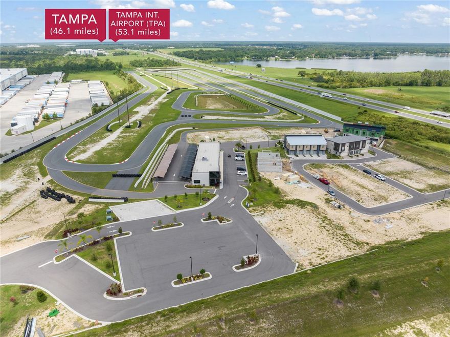 Under Construction. Where sophistication meets exhilaration! Central Florida’s premier, luxury garage-condo community, Circuit Florida invites you to live, drive, and connect in unparalleled style. This stunning 1-bedroom, 1.5 bathroom townhome-style condominium offers refined living with high-end finishes and designer touches, along with an expansive garage meant for your personal automotive showcase. With an insulated, climate controlled garage with capacity to expand, 396 Chicane Circle Unit 5 offers seamless access to the private, 1.7-mile road course, a spacious open floor plan with custom upgrades and a balcony for your enjoyment while you get ready for the thrill of your next lap. Designed for true car enthusiasts, owning at Circuit Florida is more than luxury real estate, it’s exclusive membership. As a resident, you are part of an elite enclave with access to the meticulously crafted road course featuring 14 dynamic turns, a 1/3-mile straightaway, and over 40 feet of natural elevation change, built under the vision of renowned designer Bob Barnard. Imagining owning one of only 75 luxury condos in a true motorsports country-club ambiance, with plans and amenities that include a clubhouse, lounge, pool, gym, restaurant, and a manned guard gate, all designed to foster community among fellow enthusiasts. Ideal for both a permanent residence and weekend retreats, and conveniently situated between Orlando and Tampa, Circuit Florida offers easy access to both cities, while providing the serenity and privacy of an automotive sanctuary. Ready for your prized vehicles, this opportunity is rare as Circuit Florida is one of the only garage-condo communities in Florida zoned for legal overnight stays. With that in mind, great care was taken in construction to use the highest rated noise-reduction windows on the market, as well as extra insulating materials in the masonry core between units to ensure exceptional sound privacy. So after your day on the track is complete, enjoy the community amenities, stay overnight, wake up and do it again! With no need for build-out after purchase, whether you are a seasoned collector, performance driver, or just love motorsports, this is a destination you, and your cars, will be proud to call home. Schedule your private showing of this special opportunity today!