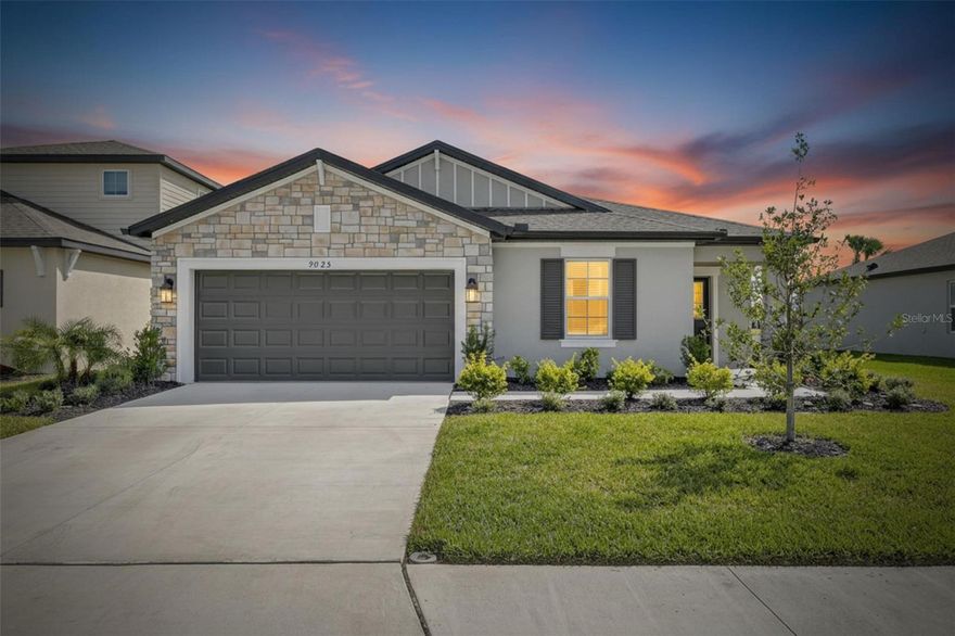 9825 Last Light Glen, Parrish, FL | 4 Bedrooms | 2 Bathrooms | 2-Car Garage | 2110 Sq Ft | Gated Community | Pond View

Better than new and located in the gated Cove section of the Summerwoods community, this 4-bedroom, 2-bath home offers a pond view and a move-in-ready interior with upgrades already completed. Why wait for new construction when this home has already been finished with new lighting fixtures, ceiling fans, blinds, and fresh paint in the main living areas.

Inside, the home features light, modern colors and finishes, tray ceilings, recessed lighting, tile flooring throughout the main living areas, and an open split-bedroom floor plan designed for both everyday living and entertaining. The front room features sliding barn doors, creating a flexible space that can easily function as a fourth bedroom, office, or flex room depending on your needs. The garage includes epoxy flooring, and the exterior is enhanced with stone accents and gutters.

The kitchen is designed to be both functional and stylish with quartz countertops, 42" upper cabinets with crown molding, stainless steel appliances, an upgraded dishwasher, subway tile backsplash, farmhouse-style sink, and a large center island with breakfast bar seating.

The primary suite offers a spacious bedroom, large walk-in closet, and an en suite bath with dual sink vanity and walk-in shower with tile to the ceiling. Additional bedrooms provide comfortable space for family or guests.

Sliding glass doors lead to the covered rear patio overlooking the full length of the pond, creating a peaceful outdoor space to enjoy Florida living. The property also benefits from additional space on one side of the lot due to the easement, offering more separation from the neighboring home.

Summerwoods amenities include a clubhouse, community pool, splash pad, playground, and two dog parks. Located in the growing Parrish area just off I-75, you’re close to new retail, restaurants, and local attractions including the Florida Railroad Museum, with an easy drive to outlet malls and the world-class Gulf Coast beaches.

If you’re looking for a gated community home with pond views and completed upgrades, 9825 Last Light Glen offers comfort, space, and convenience without the wait of new construction.