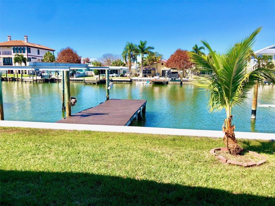 Attention BOATERS, SUNSET WATCHERS, & ZEN SEEKERS! This WATERFRONT 2 BEDROOM block home in Redington Shores sits on an EXTRA-WIDE, DEEP CANAL. NEW SEAWALL (2021), ROOF (2019). Entering the front door, you will immediately notice the airiness of the VAULTED CEILINGS and LARGE OPEN FLOOR PLAN with water views from almost every room. There's a LARGE LIVING ROOM that open to a LARGE FAMILY ROOM leading to a large covered lanai, perfect for entertaining! Take the extra-wide canal to the Gulf of Mexico! Come back from a day on the water, rinse off in the outdoor shower, then drip dry on the large covered lanai while you relax with a new SUNSET to greet you every night! In addition to the covered lanai on the water side, there's a lovely front yard garden, offering two “outdoor living areas”. The double wide driveway and carport provide plenty of parking. Walk or ride your bike to our white sand beach, where you can relax in the warm water, collect seashells, or just enjoy having your toes in the sand! There's a neighborhood playground and park just a few doors down, as well as plenty of beach shops and quaint restaurants within walking/biking distance. Don't miss the opportunity to own this little piece of heaven!