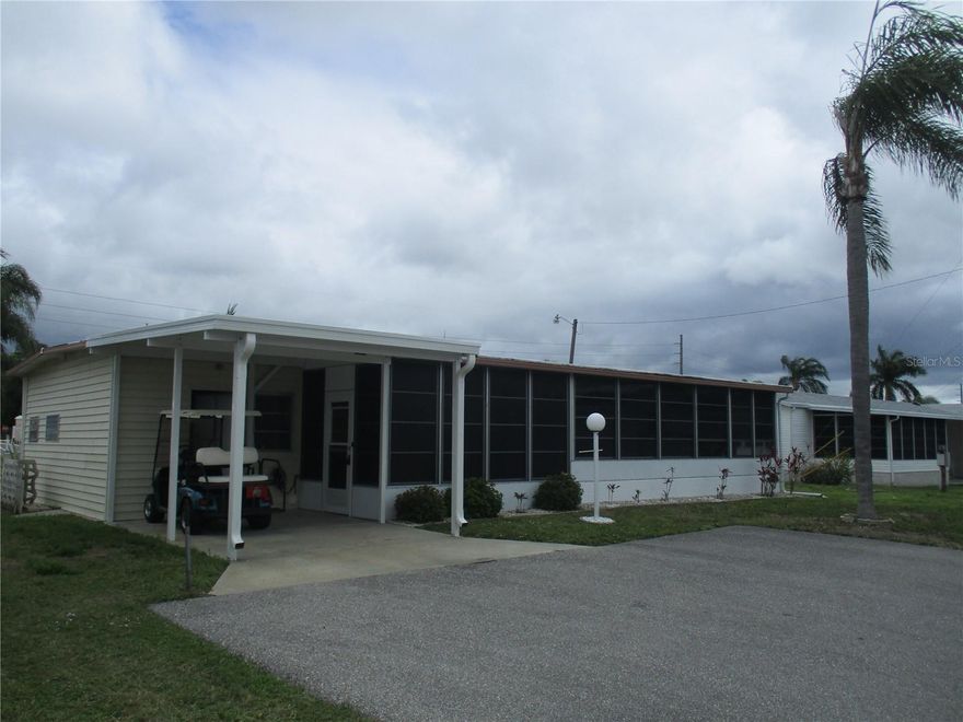 You're gonna love this "adorable 2 bedroom, 2 bath, Double Wide Mobile Home in pristine Golf Lakes Estates.  Land owned. 55+ Gated Community! No pets. Home sits back on a cul-de-sac.  Covered carport parking for your car.  Inside shed laundry closet.  Home features "furnished" 2 bedrooms, 2 full baths both with walk-in showers - no bathtubs.  Primary bedroom en suite has a walk-in closet.  There is an extra large covered front lanai with vinyl windows maybe accessible to a 3rd  bedroom if needed.  Detached golf cart barn can also be used for storage.  Active community has a fully equipped clubhouse swimming pool, heated spa, fitness center, pickleball, shuffleboard, lawn bowling courts.  A pitch & putt golf course for the avid golfers. Even yoga, dance and singing clubs.  For those who love to keep busy.  This is the community for you!  Sellers leaving furnished but taking all personal items..  Call for your exclusive showing today!