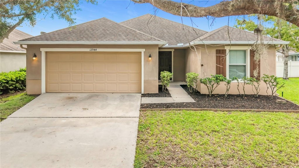 Photo of 12944 Boggy Pointe Drive, Orlando, FL 32824 (MLS # O6437095)