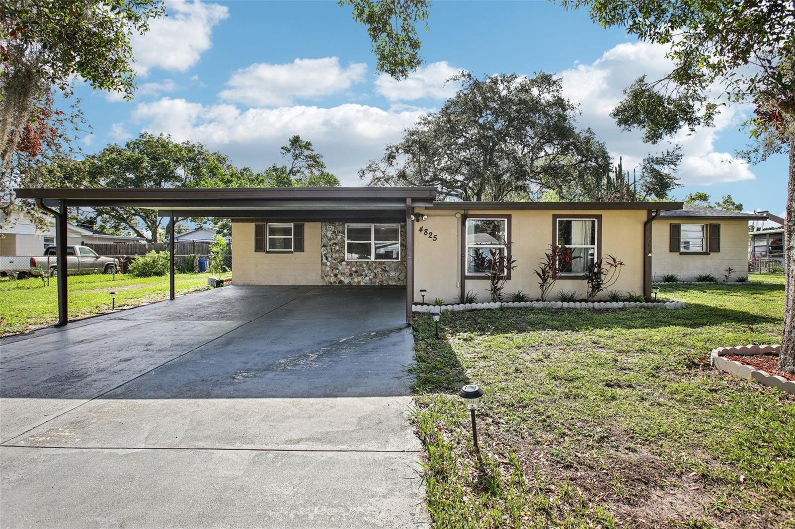 Embrace peaceful, purposeful living in this beautifully maintained 3-bedroom, 2-bathroom home located in the quiet Deatons Estates neighborhood of Lakeland. Built in 1963, this thoughtfully updated 1,540 sq. ft. residence sits on a generous 0.32-acre lot and is perfect for those seeking a homestead-friendly lifestyle. Step inside to a bright and open floorplan with crown molding, tile flooring, and a spacious family room featuring a warm natural wood plank ceiling. The updated kitchen includes wood cabinetry, a modern tile backsplash, stainless steel appliances, and a large center island—ideal for preparing homegrown meals. The home offers two updated bathrooms with clean tile finishes and modern fixtures. The primary suite includes a built-in closet and walk-in shower.
Outdoors, enjoy a fully fenced yard complete with a garden space ready for your vegetables and herbs, a cozy duck house for your feathered friends, and a relaxing hot tub for unwinding after a fulfilling day. A shed provides extra storage, while a two-car carport and driveway ensure ample parking. With no HOA restrictions, this property offers freedom to live the way you want—whether that’s gardening, raising animals, or simply enjoying the open space. Conveniently located near schools, shops, and main roads, this one-of-a-kind property is ready to welcome you home.
Schedule your private showing today and start your homesteading journey in comfort and style!