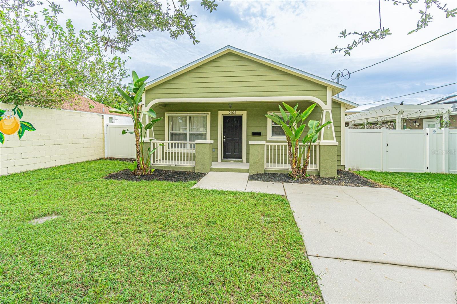 Step into a modern oasis in the heart of Tampa's vibrant North Hyde Park! With an amazing front covered porch that welcomes you home, this stunning 3-bedroom, 2-bathroom residence is a true gem, offering a perfect blend of modern comfort and prime city living. Built in 2004, this concrete block home is move-in ready and designed for a dynamic lifestyle. The interior is bright and welcoming, with an abundance of natural light creating a warm and inviting atmosphere. Featuring a great open-concept layout and spacious bedrooms, this home is ideal for both seamless daily living and entertaining. The flow from the living area to the huge kitchen is effortless, making it easy to host gatherings with friends and family. The kitchen is a true chef's delight, with a clean, functional design that offers ample counter and cabinet space. Rest easy knowing the home is protected by a brand new roof, installed in 2025—a key upgrade that provides both curb appeal and peace of mind for years to come. Outside, the property offers a private and secure retreat from the city's hustle. The backyard is a serene escape, completely fenced-in with a durable vinyl fence and a striking 8 foot-tall concrete wall along the western boundary, ensuring ultimate privacy. The large patio area is a perfect extension of the indoor living space, ideal for grilling, outdoor dining, or simply soaking up the Florida sunshine. This home is more than just a place to live—it's a gateway to an enviable lifestyle. The home is just minutes from the boutique shops and fine dining of Hyde Park Village, the bustling energy of Downtown Tampa, and the convenience of Tampa International Airport. Experience the perfect blend of a private retreat and a vibrant urban lifestyle in this remarkable North Hyde Park home.