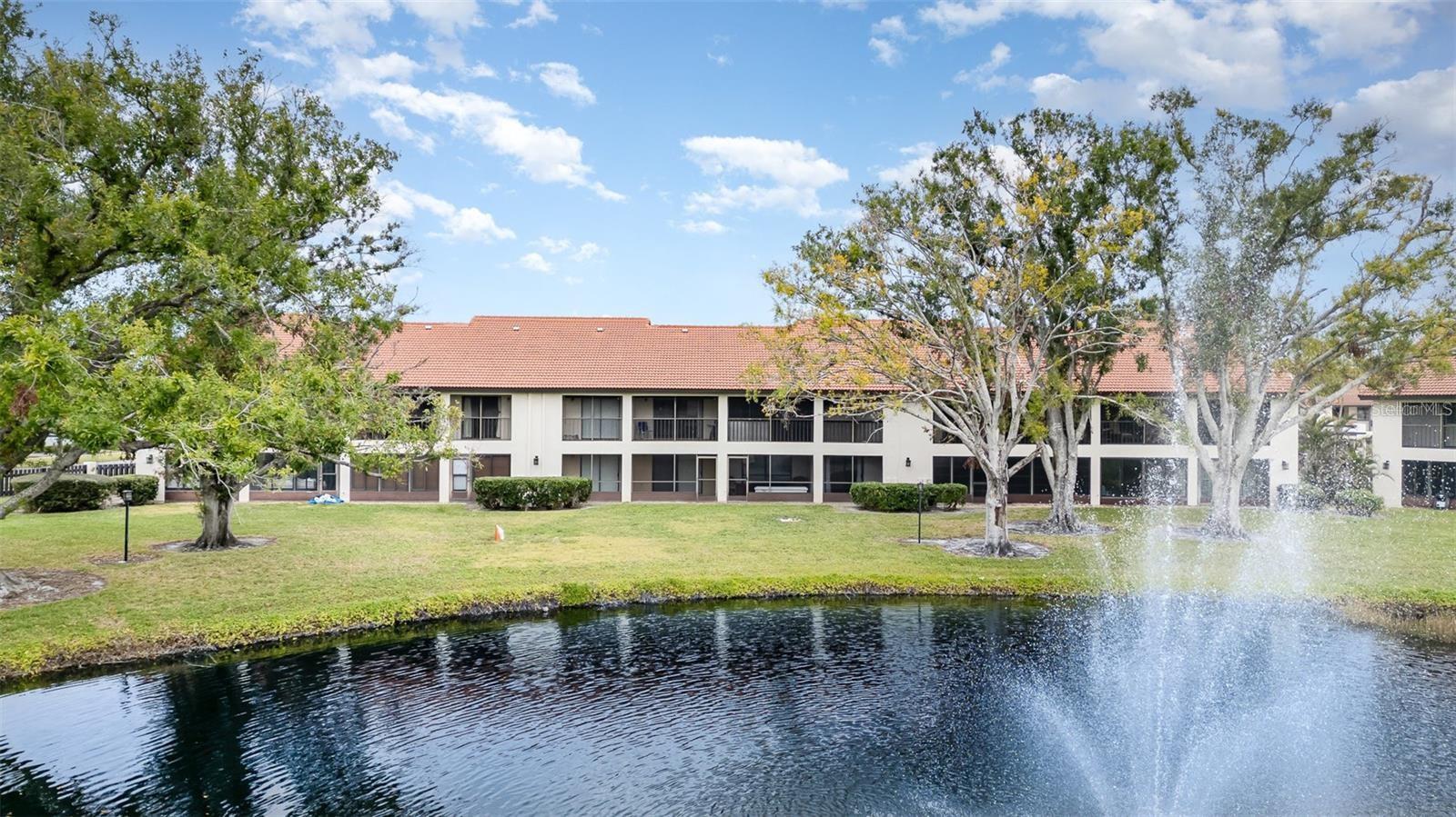 Welcome to this beautifully renovated turnkey-furnished 2-bedroom, 2-bathroom condo in the sought-after Estancias of Capri Isles. Offers 1% lender credit at closing. This second-floor unit offers a perfect blend of modern upgrades, comfort, and convenience in a peaceful community setting. The newly remodeled kitchen features ample storage, recessed lighting, and generous counter space, making it ideal for cooking and entertaining. A stylish updated bar area with a bar fridge adds both charm and functionality. Both bathrooms have been tastefully updated, and new tile flooring flows seamlessly throughout the living room, dining area, kitchen, and lanai for a cohesive, modern look. The open-concept living space extends to a screened-in, tiled lanai, where southern exposure fills the home with natural light and offers serene views of a tranquil fountain and lush open space—a perfect retreat for morning coffee or evening relaxation. New roof (2025). The spacious bedrooms provide a comfortable escape, with the primary suite featuring an updated ensuite bathroom for added privacy. This condo also includes an assigned carport to protect your vehicle and additional outside storage for extra convenience. Residents of Estancias of Capri Isles enjoy fantastic community amenities, including a refreshing pool, clubhouse, and beautifully maintained walking paths. The HOA covers cable, internet, and all lawn maintenance, allowing for a truly hassle-free lifestyle. Golf enthusiasts will love the proximity to Capri Isles Golf Course, while those seeking dining, shopping, and entertainment will appreciate the condo’s location near grocery stores, restaurants, and local attractions. With downtown Venice and Venice Beach just minutes away, you’ll have easy access to the area’s best coastal experiences. Convenient access to major highways ensures seamless travel to surrounding areas. This stunning, move-in-ready condo offers the perfect blend of style, convenience, and community living. Schedule a private tour today and start enjoying the Florida lifestyle!