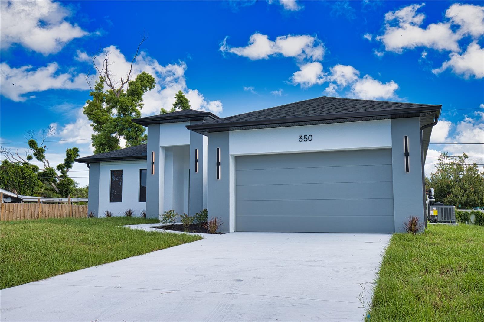 This GREAT VALUE, new-construction 4/2 home provides a modern and peaceful living space in the thriving community of Venice. The NO HOA, NO FLOOD ZONE, 1 YEAR BUILDER'S WARRANTY and LOCATION make this home a real find! As a SOUTH VENICE resident, you can take advantage of the SOUTH VENICE BEACH FERRY, transporting you to your own PRIVATE BEACH on Manasota Key and gain access to the resident BOAT LAUNCH. This serene neighborhood is close to many unique activities such as several nature parks, Legacy Trail, Historic Downtown Venice, Warm Mineral Springs, Venice Fishing Pier and is a 6 minute drive to Manasota Beach, a 15 minute drive Venice beach! The 4th bedroom gives the flexibility of use for an office, gym or craft room to suit your needs. The home's exterior is welcoming and stylish with modern lighting and landscaping along with the peace of mind of hurricane impact windows and a high elevation. The open floor plan allows you to enjoy the main living areas simultaneously. The living room, dining area, and kitchen flow together perfectly, providing the ideal space for entertaining or family gatherings. The high tray ceiling, ceiling fan and large windows flood the main area with natural light and create a cheerful and inviting atmosphere. The neutral color palate allows you to add your personal touches and customize your look. The heart of this home is the sleek, modern kitchen. The quartz countertop and breakfast bar are perfect for casual dining and gathering. Soft close cabinets with gola profile and drawers with a modern, stylish and clean look. Stainless steel appliances, ample cabinet storage space and pantry complete the wish list for a perfect kitchen. The spacious dining area is designed for serving family meals or entertaining and includes a beautiful chandelier that contributes to this home's unique charm. Sliding glass doors provide access to the large covered porch off the main living area creating a seamless transition from indoor to outdoor living space. The master suite is a TRANQUIL RETREAT elevated by gorgeous tray ceiling, ceiling fan and sliding door to back yard. The en-suite bathroom feels like a PRIVATE SPA with a gorgeous OVERSIZED SHOWER, rain shower head, upgraded LED mirrors and soft LED lighting under the vanity to provide you a peaceful haven. 3 additional bedrooms with ample closet space and ceiling fans share a well-designed bathroom with a tub and the same upgraded rain shower head, LED mirrors and LED lighting. Laundry will be less of a chore in this spacious and neat laundry room featuring a convenient utility sink with cabinet. The 2 car garage conveniently leads to the laundry room for the perfect transition upon your arrival home. This property is staged and easy to show! It's features, proximity to beaches, S Venice resident perks and unique outdoor/shopping activities make this house the ideal place to call home.