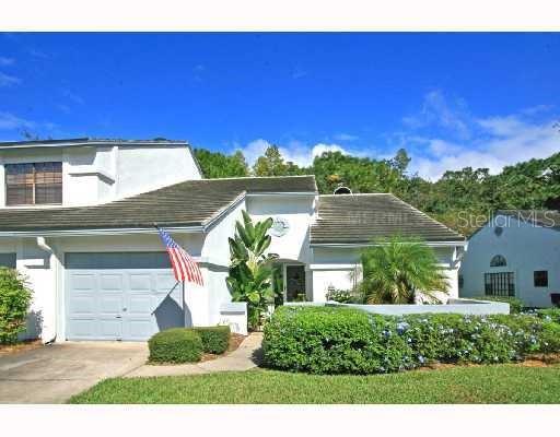 Welcome to this rare, single story end unit villa-bright, spacious and full of natural light. Located in a beautifully maintained community, you'll be greeted by manicured streets, majestic palm trees, lush landscaping, and an updated pool and spa area that create a truly inviting atmosphere. Step through your private wrought iron gated entrance into a cozy front patio, then enter the home through the attached garage. Inside, you'll appreciate the soaring vaulted ceilings and a thoughtful split floor plan that offers privacy and functionality. The oversized 16x18 living room provides ample space for relaxing or entertaining, while laminate and ceramic flooring throughout means no carpet and easy maintenance. The primary suite is generously sized and features a large walk-in closet, and a linen closet. The second bedroom is perfect for guests, an office, or additional family members. You'll also enjoy the convenience of an indoor laundry room-washer and dryer included. Unwind on the secluded 9x18 screened and covered back porch-ideal for enjoying your morning coffee or a good book in peace. Located minutes to the Northdale entrance, Dale Mabry HWY, the Veterans Expressway, shopping, dining and Claywell Elementary /Gaither HS and more popular and iconic spots. Available late September. Room sizes are estimates and should be verified. Application fees apply. Pet policy upon request. Don't miss out on this cozy, low maintenance villa in a prime location.