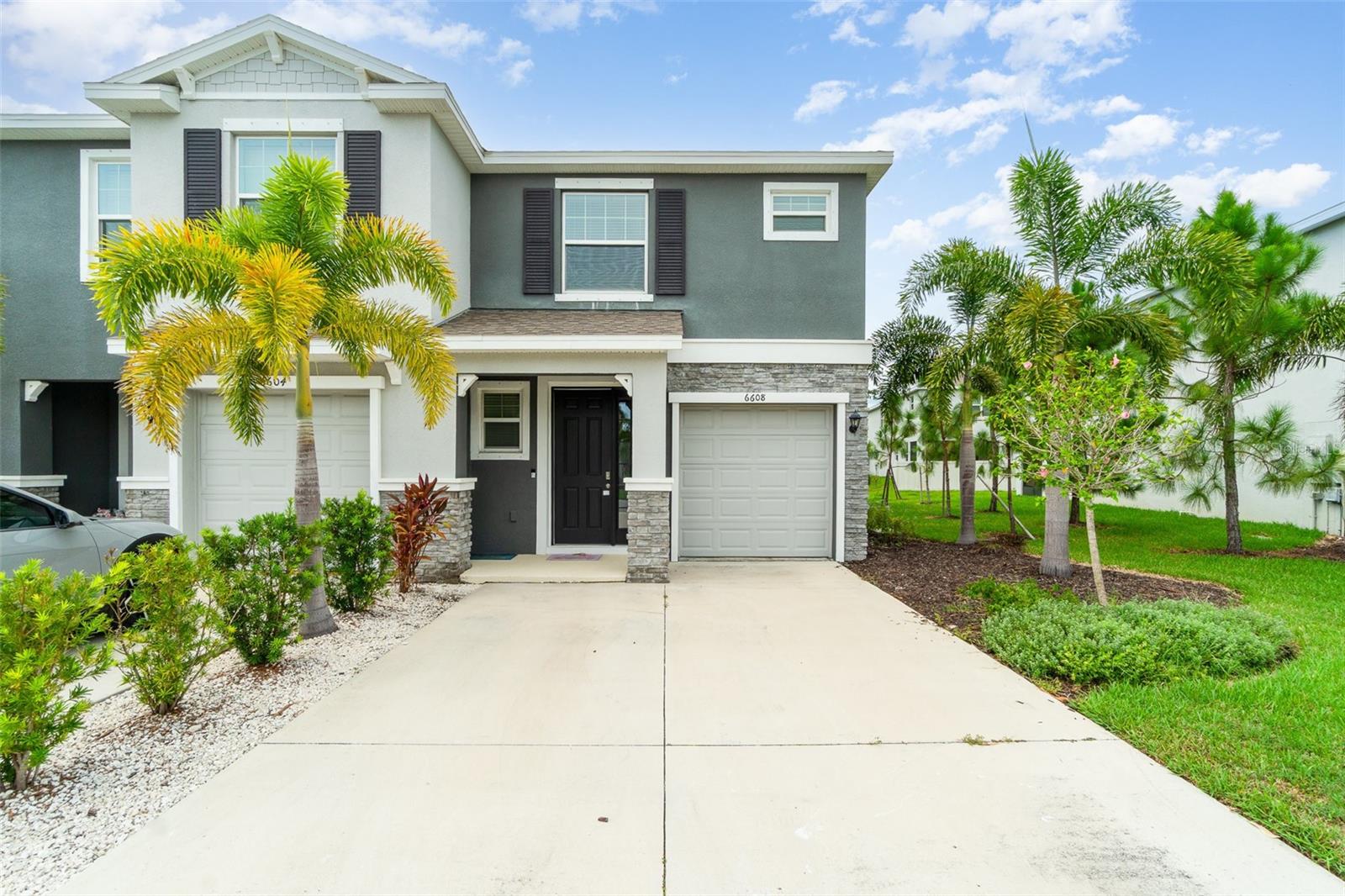 Welcome to this beautifully maintained end-unit townhome in the highly desirable Bay Landing community. Built in 2021, this spacious home offers 1,808 square feet of living space with 3 bedrooms, 2.5 bathrooms, and an attached one-car garage. Its thoughtful design and private setting make it ideal for both full-time living and seasonal enjoyment.
Step inside to discover a bright and open layout featuring a large kitchen with granite countertops, stainless steel appliances, and a generous pantry—perfect for everyday cooking and entertaining alike. The living and dining areas flow seamlessly and open to a screened-in lanai overlooking the lush, private backyard, creating an ideal space for relaxing or hosting guests.
Upstairs, the oversized primary suite offers a peaceful retreat with a large walk-in closet and en-suite bathroom. The bedrooms feature custom-made closets, adding both style and smart storage solutions. Two additional bedrooms and a full bath provide ample space for family, guests, or a home office.
Bay Landing is a maintenance-free community with no CDD fees and low HOA fees, yet it still offers great amenities including a resort-style pool, fitness center, dog park, and playground. Located just minutes from UTC, Waterside, downtown Sarasota, and world-class beaches, this property combines comfort, convenience, and Florida lifestyle living.
