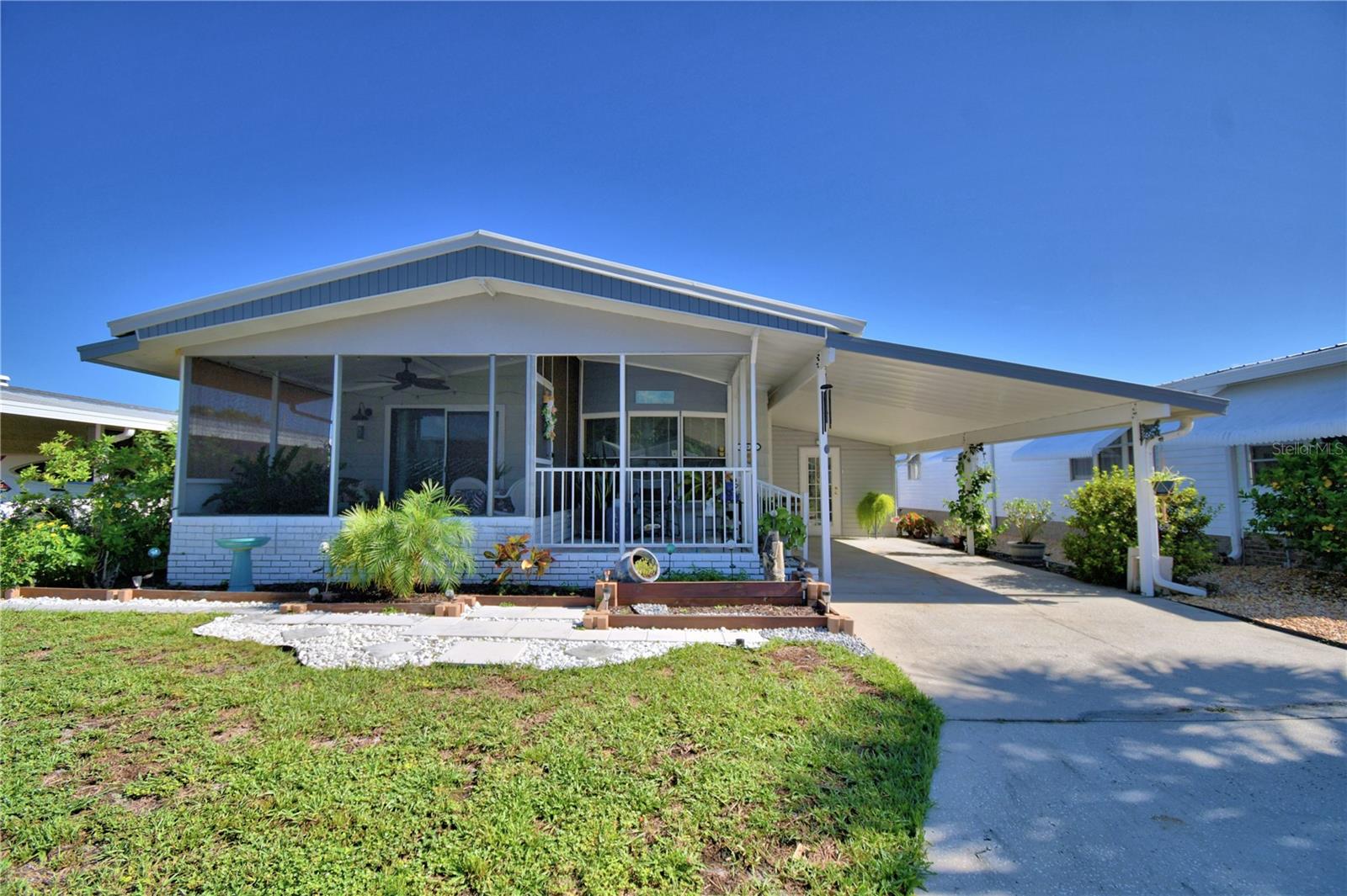 This lovely home is a MUST SEE in Oakwood Estates 55+ community! This well-maintained and updated 2 BR/ 2 BA home has a warm and cozy feeling from the time you enter the home. Inside features a large great room, kitchen with separate dining room, office space, and two nice-sized bedrooms. No carpeting throughout for easy maintenance. The huge storage area has been extended by the current owners, providing you with plenty of room for all of your extras plus a generous laundry area as well. All appliances are included with the sale. The air-conditioning unit was replaced in 2023. Most windows were also replaced in 2023. Plumbing was updated to CPVC in 2017. This home is truly move-in ready! Outside you can relax on your screened-in patio or the open patio area. The community offers many activities and ammenities to keep you as busy as you would like to be. This home is located in the NO DOG section, but indoor pets such as birds, cats and fish are allowed. Don't miss out on scheduling your private tour today! You will not be disappointed.