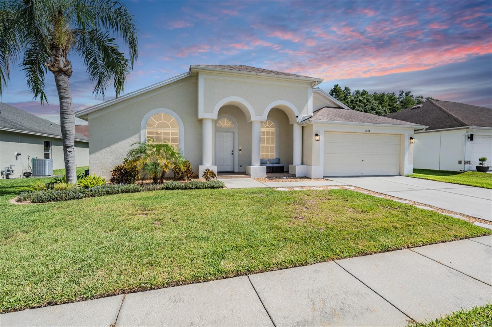 18143 Palm Breeze Drive- This property features a spacious layout with Four bedrooms, Three bathrooms, Two Car Garage, Pool, and a large backyard. Showcasing super clean living areas with New LVP flooring throughout, including carpeted bedrooms. The home boasts a modern kitchen with Quartz Countertops, Gas range, and updated Cabinets with pull out drawers, Stainless Steel Appliances, Water Softener and all newly painted interior 2025. The Master Bathroom has a walk in closet, double Vanities along with a separate tub and shower. The high ceilings and inset lights create an airy atmosphere. Additional amenities include a painted garage floor, New fans and light fixtures, a resurfaced pool with a 10 year warranty and new LED lighting. The HVAC (2022) and sprinkler systems (2024) are newly updated, with very LOW HOA fees and NO CDD fees, making it a desirable option for comfortable and affordable living!
