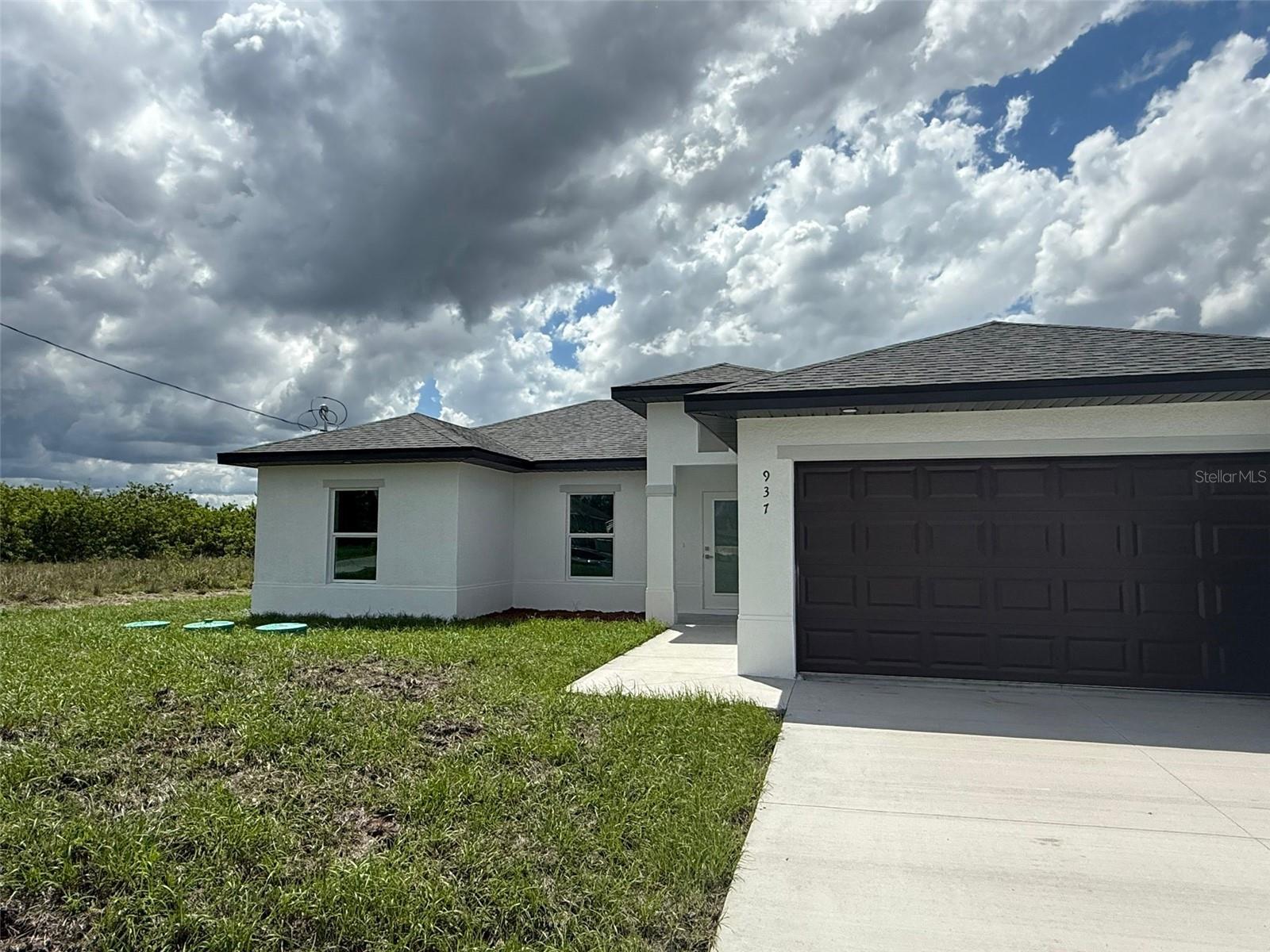 Experience the best of Florida living in this beautiful new construction single-family home in Lehigh Acres. Enjoy the lake views from the
comfort of your own home, perfectly situated to take in the serene surroundings. This home features 3 spacious bedrooms, including a master
bedroom retreat, 2 bathrooms, 2-car garage for ample storage and parking, porcelain floors throughout for durability and style, Stainless steel
appliances for a sleek look. The open floor plan is perfect for entertaining and everyday living. Enjoy the peaceful atmosphere from your back
patio . This home offers the perfect blend of relaxation and Florida living. Don't miss out on this incredible opportunity, a must see!
