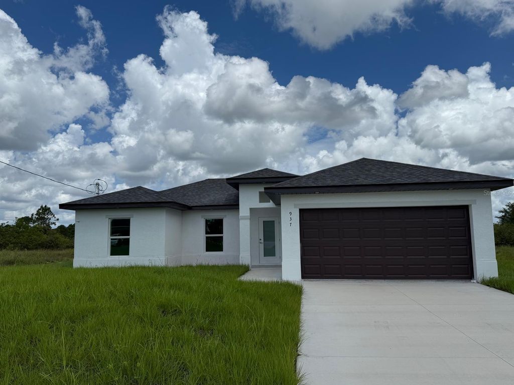 Photo of 937 Grant Boulevard, Lehigh Acres, FL 33974 (MLS # S5131335)
