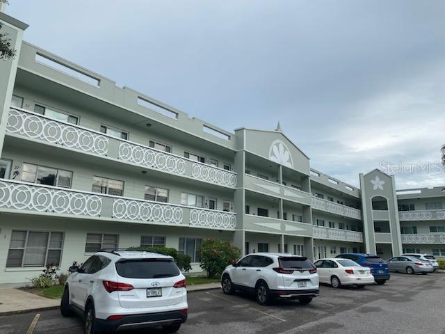 Welcome to Clearwater's premier 55+ community, on top of the world where relaxation, comfort, and an active lifestyle come together. Nestled in the heart of Clearwater, The interior features 2 bedrooms 2 full bathrooms 1,100 heated square feet and is completely furnished, The open floor plan creates an inviting ambiance, allowing natural light to flow effortlessly throughout the home. As you enter, you're greeted by a stylish foyer that leads into the main living area. The living room is perfect for entertaining or simply unwinding after a day of enjoying the community's amenities. With plush seating and tasteful decor, it serves as a cozy retreat where you can gather with friends and family. Adjacent to the living room, a dining area awaits, providing an elegant space for formal meals or casual breakfasts. kitchen with all appliances Refrigerator, Countertop microwave oven, stove top and a built in oven. With a front loading washing machine. The sunroom is a delightful enclosed space that brings the beauty of the outdoors into the comfort of your home. It is an ideal sanctuary where you can relax, unwind, and enjoy the natural light and surrounding views. Can be used as a den, a sunroom becomes an inviting retreat for various activities such as reading, working, or simply spending quality time with family and friends. Assigned parking right outside The 55+ community has two activity centers, and two private golf courses with 9 and 18 holes. There are two swimming pools; one is heated. The remodeled Cardio Gym has the latest exercise equipment. A very pet-friendly , entertainment, classes, and much more. Association approval is required. If financing, 35% down is required.