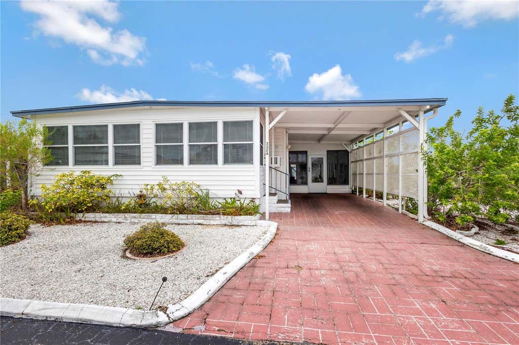 Photo of 3324 W Tiki Drive, Holiday, FL 34691 (MLS # TB8530723)