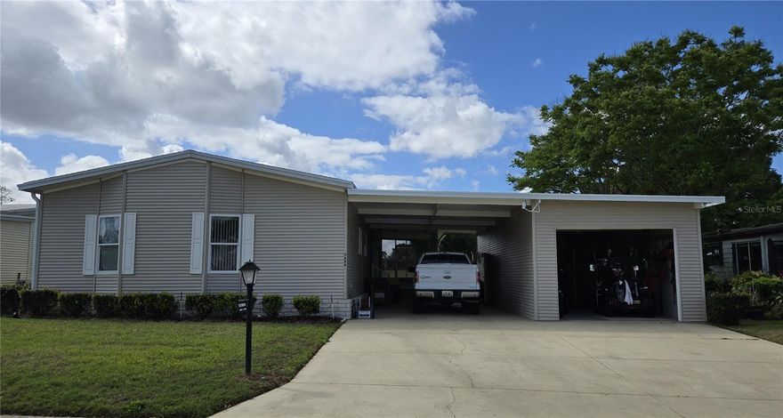 MOVE IN READY very well-maintained home in Zellwood Station. Three bedrooms (or 2-bedroom den, there IS a closet), original snowbird owner. GOLF COURSE VIEW (17th hole) as well.  Open floor plan and great view! Updated appliances, newer roof. Large primary bedroom with en-suite and coveted indoor laundry room. Furnishings optional. Extra-large garage (13X38) with cabinets, work bench, tons of storage. Zellwood Station is a Resident Owned 55+ Golfing Community located between Apopka and Mt Dora.  We have a 72 Par golf course, 4 pools, pickleball and tennis courts; water exercise and line dancing classes and our own Whistle Stop Restaurant and Lounge with banquet facilities.  There is always something to do here.  Close to the 429 for easy access to airports and attractions, we are close to shopping, restaurants, medical facilities and churches.  Come and see what we have to offer!