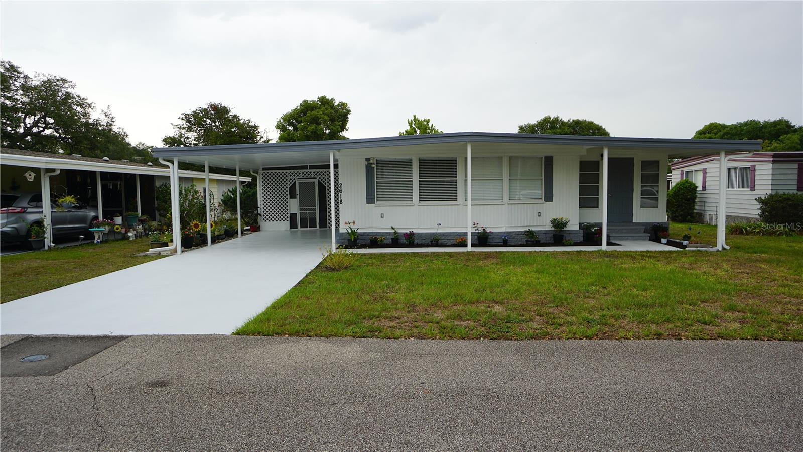 Beautifully updated 2-bedroom, 2-bath manufactured home, mostly renovated in 2022, located in the serene 55+ community of Mt. Dora. The current owner has lovingly maintained and improved the home with thoughtful upgrades, including a brand-new kitchen, modern appliances, updated flooring, renovated bathrooms, refreshed electrical outlets, and fresh interior and exterior paint.
Enjoy the light-filled Florida room featuring abundant windows and a sliding glass door that opens into a welcoming family room—perfect for entertaining or relaxing. The spacious master bedroom includes a generously sized en-suite bath and a walk-in closet for ample storage.
Dora Pines offers residents access to a community pool and recreational facilities tailored for an active, social lifestyle. With a low HOA fee of just $60 per month and the added benefit of owning your lot, this is an exceptional opportunity to enjoy living in a friendly community.
Come see this charming home for yourself—it won’t last long!