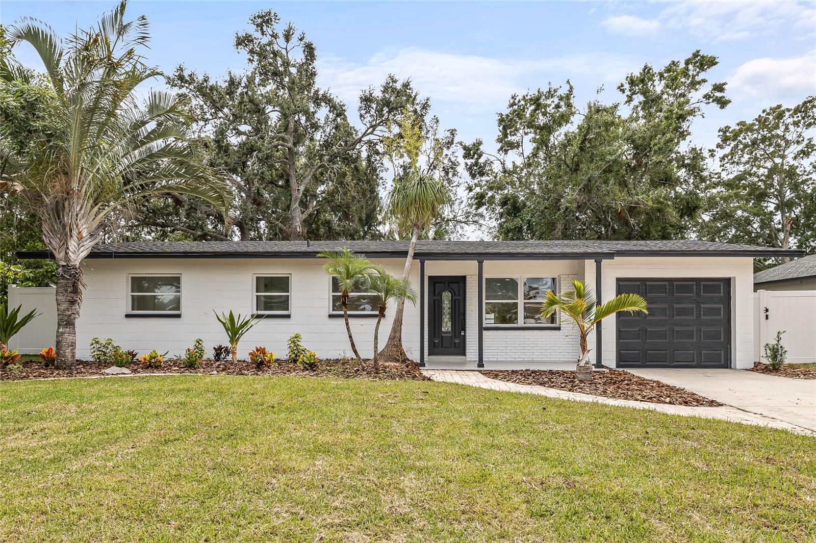 Welcome to your dream home in the heart of Tampa! This beautifully renovated 4-bedroom, 3-bathroom gem boasts charm, style, and modern convenience—all just minutes from downtown, Bayshore Boulevard, and Davis Islands. Step up to a home full of curb appeal, then walk inside to a bright, open floor plan where the spacious living room flows effortlessly into the kitchen and dining areas—perfect for entertaining or family gatherings. The stunning chef’s kitchen features brand-new countertops, stylish cabinetry, stainless steel appliances, and a kitchen island ideal for casual dining or meal prep. All four bedrooms are thoughtfully positioned on one side of the home, including two well-appointed guest rooms with a shared bathroom and two luxurious primary suites, each with spa-like ensuite bathrooms offering comfort and privacy. Through the dining area, sliding glass doors lead to a screened-in back porch overlooking your fully fenced backyard oasis—complete with a sparkling pool, perfect for relaxing or entertaining. With a 1-car garage, 2020 HVAC, and brand-new 2025 roof and water heater, this home is truly move-in ready in a location close to top dining, shopping, and entertainment. Don’t miss your chance to own a slice of paradise in Tampa—schedule your private showing today!