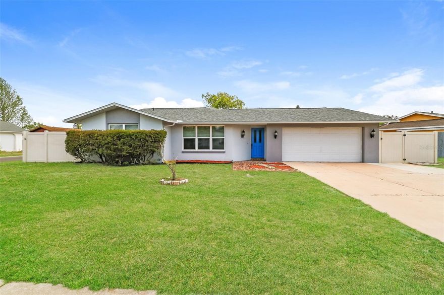 Charm and curb appeal abound for this Port Richey home! Step inside into the inviting foyer and into the kitchen, which is positioned at the center of the home and boasts stainless steel appliances, hard surface countertops, and ample storage. Living and entertaining space is plentiful with this home as it offers a well-appointed living room, dining room, and family room as well. This ranch style floorplan is rounded out by the primary suite and two secondary bedrooms. Enjoy your private, enclosed backyard all year long! Come and see for yourself the possibilities that this home has to offer!