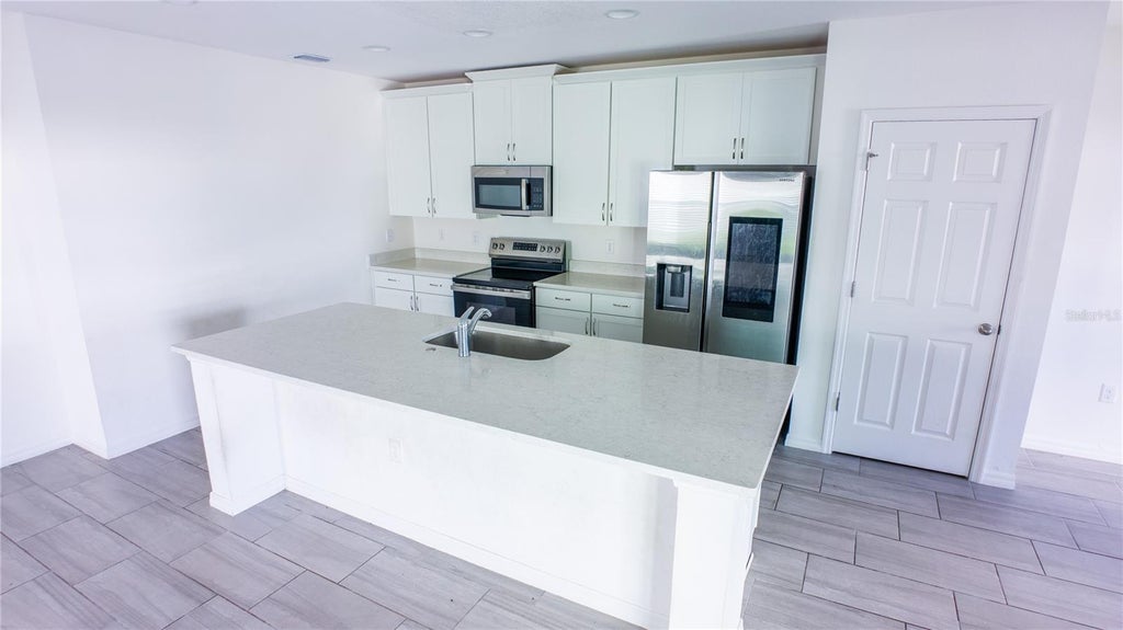 Photo of 1062 Sand Torch Circle, Davenport, FL 33837 (MLS # O6449719)