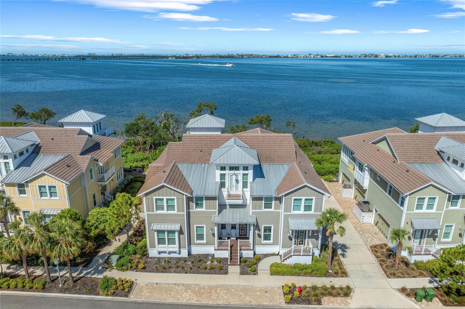 WANT TO SEE FULL, UNPARALLELED AND UNOBSTRUCTED VIEWS OF ANNA MARIA
SOUND FROM YOUR FABULOUS HOME —LOOK NO FURTHER — located in the
prestigious, beautiful, gated community of Harbour Isle. This highly sought after spacious three
bedroom and three bath Abaco style home has everything you could want for coastal living at its
best. (Furnishings are negotiable.) This light and bright home has stunning water views from
the owner’s retreat, sunroom (with wall to ceiling windows), kitchen and living area. The
sparkling waters of Anna Maria Sound can be seen in every direction and even provides looks
out into the Gulf. Spectacular sunsets can be seen each day from this stunning home. Focusing
on the beautiful interior features of the property — gorgeous wood plank look tile flooring
throughout the living areas and upgraded carpet in the bedrooms, tile flooring in the baths, 42”
white upper cabinets, granite countertops and stainless steel appliances in the kitchen with a
double oven, custom blinds and shades in every room, double vanities with granite and large
walk-in shower in Owner’s retreat, 5 1/4 inch base boards and an oversized two-car garage —
just to name a few. The building has green LEED certification, block construction with Hardie
board exterior siding and PGT impact rated windows. It is strong and built to last. Harbour Isle is
second to none. While inside the gates of Harbour Isle, explore two miles of neighborhood
walking and bike trails and find an inviting hammock for a little relaxation. Start exploring with
the amazing 23,000 square foot Beach Club overlooking Anna Maria Sound where you can
raise a glass at the Sky Bar lounge and toast the sunset and then continue with the heated
resort pool, spa, private beach to launch kayaks into the Sound, and the 4,200 square foot
fitness center. There are four pools for your use and the closest to the home is the deep water
lap pool with a lovely cabana. The Mangrove Walk pool area is just around the corner and
features grill area, and fire pit -- perfect for small gatherings. Truly an active lifestyle! If you have
a boat the wet/dry Safe Harbor Marina is the perfect place for you. Right outside this gated
community is Floridays Restaurant and the Compass Hotel. This gorgeous home is located just
a little over a mile from the sugar sand beaches and island charm of Anna Maria Island, with
over 30 restaurants and shops for your enjoyment, and less than two miles from the famous
Robinson Preserve with over five miles of walking, biking and kayaking. It’s time to start living
your best life. Live, relax, enjoy an active lifestyle in award-winning Harbour Isle. This is truly
Paradise and it can all be yours. Don’t wait. Call today. Copy and paste to browser for video: https://vimeo.com/1085836143