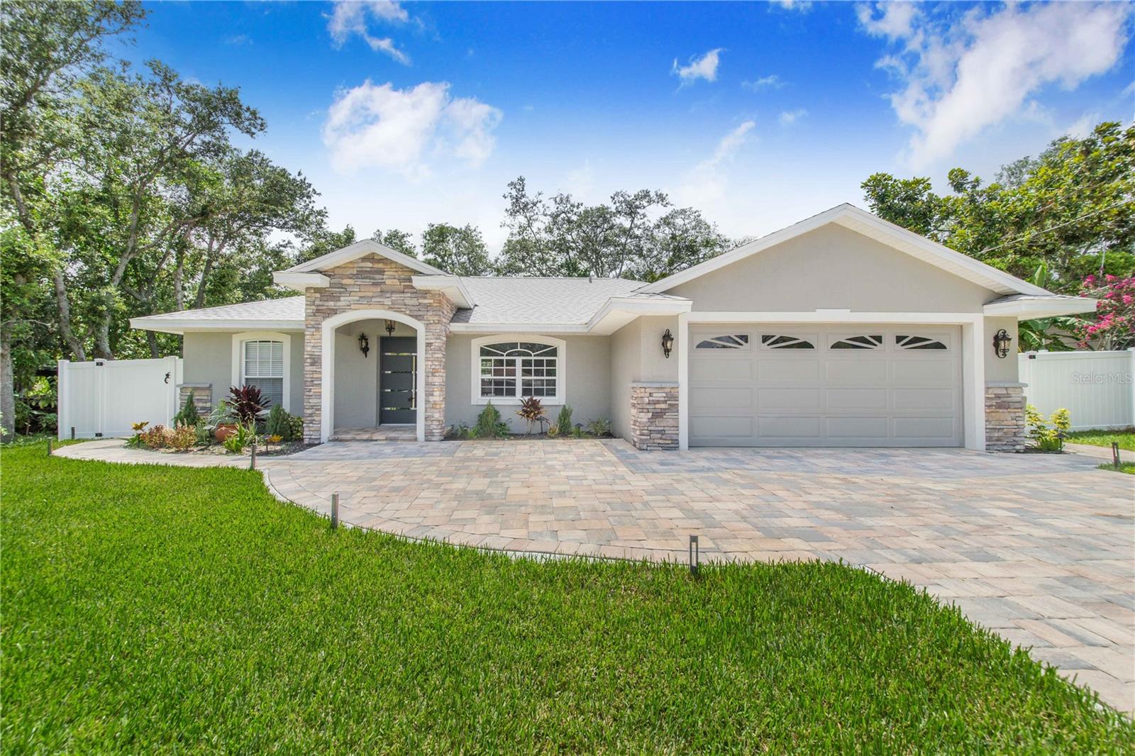 One or more photo(s) has been virtually staged. This stunning property is move-in ready, vacant, unfurnished and packed with premium upgrades inside and out. The home boasts a brand-new roof (only 6 months old), a custom paver driveway that accommodates 6–8 cars, and continuous 4-foot-wide walkways surrounding the entire home. A white vinyl privacy fence encloses the property, enhancing both security and curb appeal, while high-end stonework on the front facade, custom stone columns, and a designer front door create an elegant entrance. The professionally landscaped yard was designed by an engineer and features sculpted island beds with Sylvester palms, Japanese garden elements, fresh St. Augustine sod, and low-voltage LED lighting that brings the space to life at night. Inside, you’ll find luxurious bathrooms with Italian porcelain tiles, Kohler fixtures, frame less glass showers, granite-topped vanities, and Bluetooth-enabled smart mirrors. The gourmet kitchen is equipped with brand-new, state-of-the-art appliances—all under warranty—and is complemented by modern lighting, crown molding, and stylish finishes throughout. Each bedroom features new ceiling fans, while the spacious 2.5-car garage shines with a 15-year polyurethane gloss floor. Every detail of this home has been thoughtfully upgraded for modern design, comfort, and long-term value—ideal for buyers seeking a low-maintenance, high-style living experience. Don’t miss your chance to own one of Avon Park’s most beautifully renovated homes. This home is conveniently located just 15 minutes from Sebring, renowned for its motorsports, especially the Sebring International Raceway and the annual “12 Hours of Sebring” endurance race. Sebring also offers stunning natural beauty, including Highlands Hammock State Park and numerous lakes. Additionally, it’s only 53 miles to Orlando Airport, making travel easy and accessible. Explore this property with a 3D Interactive Virtual Tour or Virtual Reality, including a 3D Walk through video, 3D Dollhouse model, 2D Floor plan, exterior, and interior photos.