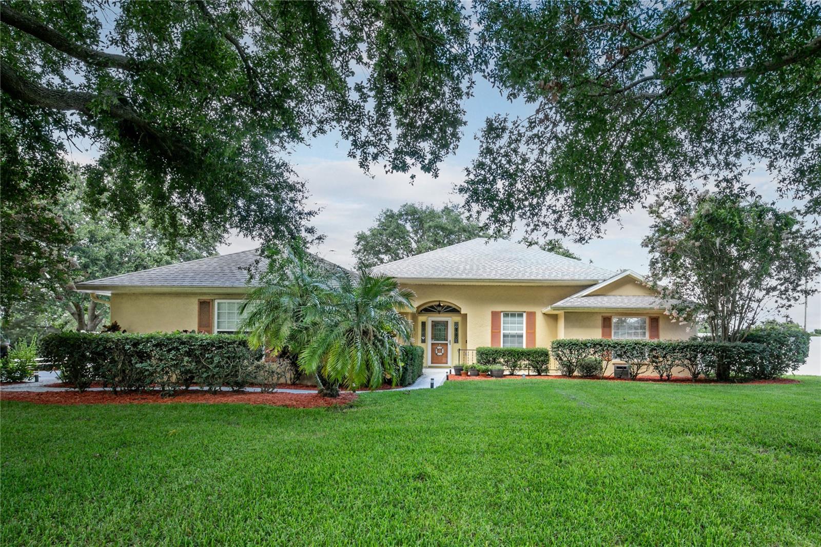 Welcome to this beautifully maintained pool home in the sought-after community of Biscayne Heights in Grand Island. Nestled on a fully fenced, oversized 0.45-acre lot with mature landscaping and no rear neighbors, this property offers the perfect blend of privacy, space, and outdoor living. Step outside to enjoy a screened-in pool with a built-in bar setup, ideal for weekend gatherings, and a cozy firepit area—the perfect spot to relax under the stars.
Inside, the home features high ceilings and easy-care laminate and tile flooring throughout. The spacious living room is warm and inviting, with French doors that open to the covered lanai and pool, creating a seamless indoor-outdoor flow. The kitchen is filled with natural light and boasts granite countertops, white cabinetry with accent lighting, stainless steel appliances, and a breakfast bar. The bay-window dining nook provides a charming space for meals and also opens to the outdoor area.
The primary suite includes a large walk-in closet and en-suite bathroom, while two additional bedrooms, a full guest bath, and a half bath offer flexibility for family or guests. Other highlights include a new roof (2022), an extended driveway with room for a boat or RV, a 2-car garage with an air-conditioned workshop, a separate storage shed, and a water filtration/softener system. With a low HOA and convenient access to shopping, dining, public boat ramps, parks, schools, and major highways, this home is a perfect mix of comfort, function, and location.