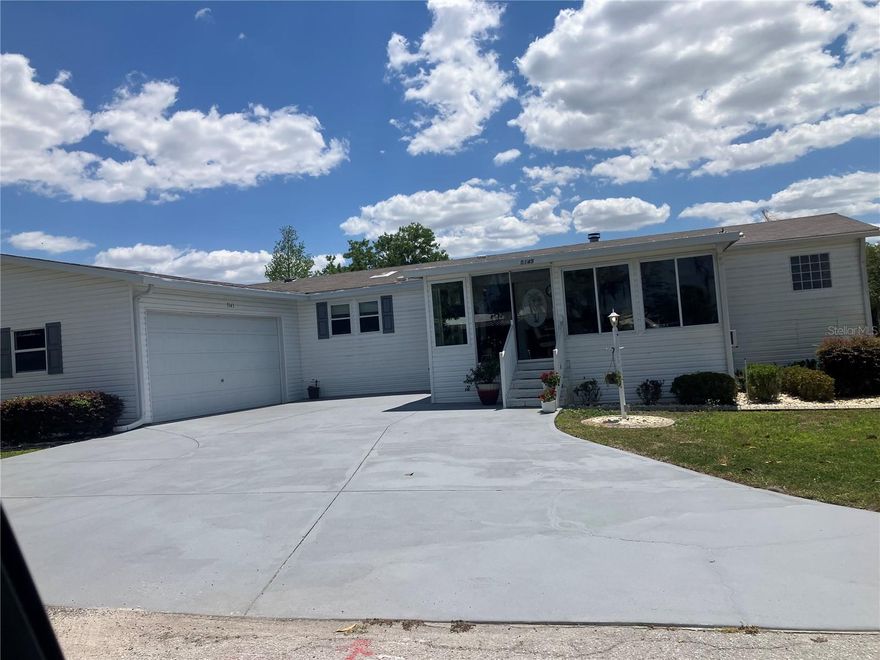 WOW One of a kind like new- Beautiful and spacious 1,848 sq ft, 3 bedrooms, 2 baths plus Den/Office an additional enclosed Glass 20 x 12 Florida room. And for the man of the house a 22 x 36 Huge Garage Man Cave! Yes, you can have it all! The Living room features a wood burning fireplace, open to dining room and large kitchen with island and breakfast bar. Off the kitchen is a large laundry room and door that leads to the huge garage. Out back is a quaint covered patio for entertaining and barbeque. And you can relax or entertain in the 20x12 enclosed Florida room. Enter the large Primary suite though the Den, the large ensuite bath features a whirlpool tub, double shower and dual sinks. the 2 guest bedrooms and large guest bath are at the other end of the home offering privacy. This Jacobson Manufactured home features 2"x 6" exterior walls with extra insulation, the interior walls are 2" x 4". Great location is just across the street from The Villages Brownwood square and entertainment, dining, Gym and shopping etc. You own the home and the land. Call today for an appointment.