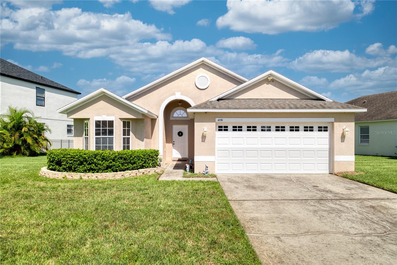 Beautifully maintained 4-bedroom, 2-bath, move-in ready home with a 2-car garage, situated on one of the largest lots in this sought-after community! This light and bright water-view home features an open split-bedroom floor plan with vaulted ceilings and stunning views that offer breathtaking sunsets. The spacious primary bedroom includes a large walk-in closet and plenty of natural light. The kitchen and bathrooms feature ceramic tile, while upgraded laminate flooring runs throughout the rest of the home, just 2 years old. The interior has been recently painted, giving the space a fresh and modern feel. Additional highlights include solid surface countertops, upgraded wood cabinets, hurricane shutters, and an eat-in kitchen. The community offers great amenities such as a pool and playground, and the home is ideally located near major highways, shopping, UCF, Lake Nona’s Medical City, and Orlando International Airport. Comfort, convenience, and scenic views come together to make this home a must-see!
