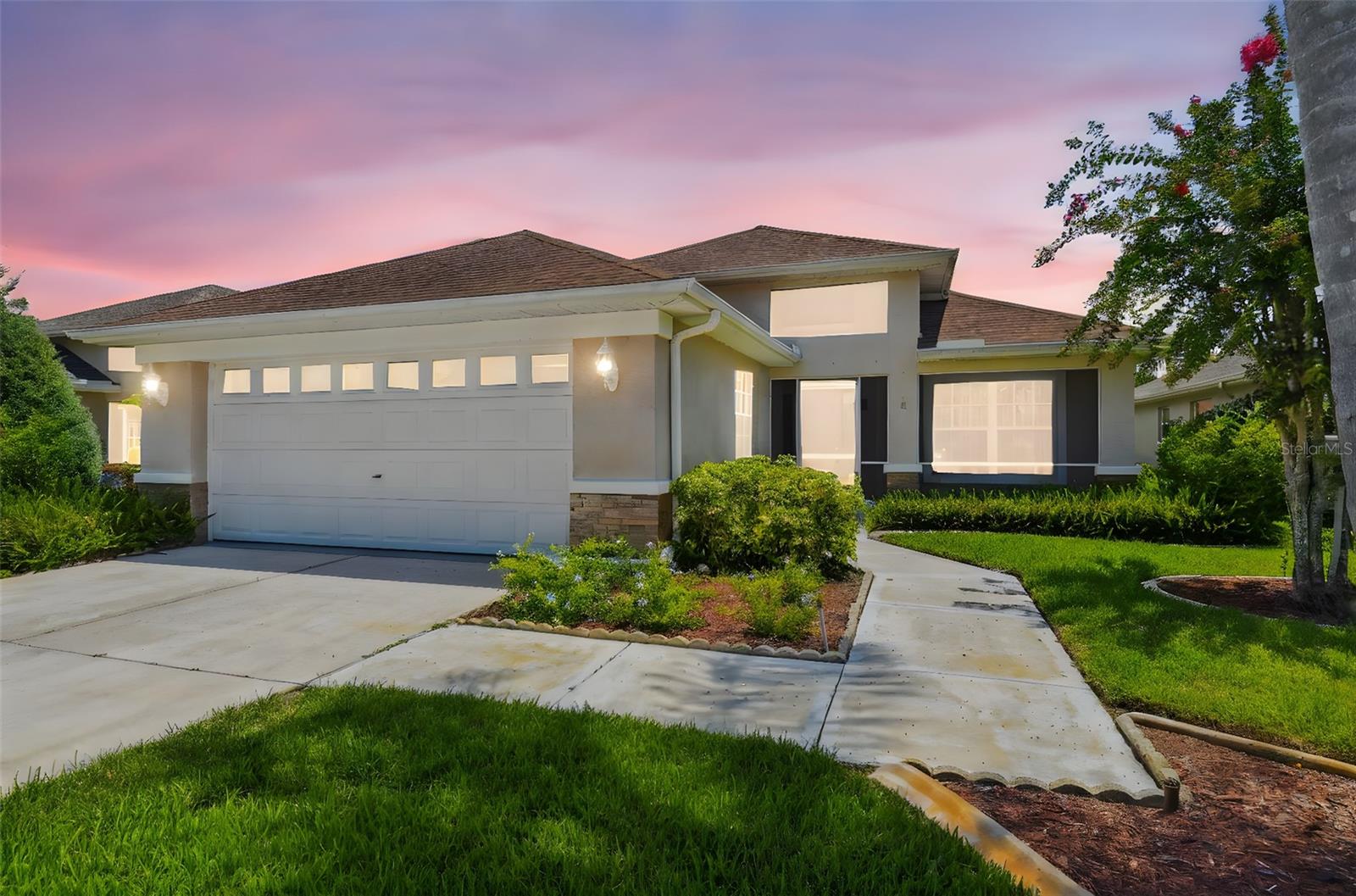 4 Bedrooms, 2 Bathrooms, 2 Car Garage, gated community. Welcome to this spacious home featuring a versatile game room, screened lanai, and screened front porch-perfect for enjoying Florida living year-round. The open kitchen floor plan flows seamlessly into the living area, highlighted by a cozy wood-burning fireplace. The large primary bedroom boasts a tray ceiling, dual closets, and a private en-suite bathroom. Brand new carpet adds a fresh touch throughout. The fourth bedroom could be utilized as an office/den offering flexibility to suit your needs. Enjoy community amenities including a pool, lawn maintenance, irrigation system on well, and garbage service all included. Home includes a water filtration system and work center with sink in the garage. Situated in a prime location close to top-rated schools, shopping, beaches, airport, mall and major highways, this home offers the perfect blend of comfort, convenience, and lifestyle.