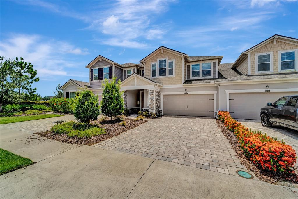 Welcome Home!! This rarely available cul-de-sac Executive townhome is the largest of the Mattamy Homes floor plans in the Harmony subdivision of Lakewood Ranch and this home boasts an open floor plan with plenty of space and loads of upgrades.
The first floor displays lovely "wood-look" porcelain plank tiles throughout, along with a brilliantly stated gourmet kitchen with 42-inch cottage cabinets and crown molding, granite countertops, stainless steel appliances and a perfectly placed center island which allows for plenty of entertaining space directly next to the adjoining breakfast room and extra-large screened in lanai.
The cozy gathering room displays loads of light between the large windows and canned lighting leading upstairs to 3 large bedrooms plus a huge loft which offers so many additional options such as using as a home office, playroom or even a 4th bedroom.
Owners Suite boasts a tray ceiling with canned lighting and large windows, walk-in closet and connecting Owner's Suite bathroom, complete with granite double bowl vanity plus a large oval soaker tub along with a separate shower.
Conveniently located 2nd floor laundry room offers plenty of room with shelving and an upgraded oversized washer and dryer. This 3 bedroom 2.5 baths with loft Executive townhome offers a fabulous location with proximity to everyday conveniences, top educational opportunities, shopping, dining, active recreation, natural wonders, and plenty to see and do. Harmony is a short distance to a new shopping center, The Green at Lakewood Ranch, across from the CORE employment center, and close to Lakewood Ranch’s Town Centers. With Lakewood Ranch High School only 1.5 miles away and loads of shopping choices such as Winn-Dixie, CVS, Burger Fi, DOGPerfect, Pacific Counter, Spa and nail salons and so much more. Conveniently located less than 5 miles from Interstate 75, this Executive townhome is an easy choice for someone looking for a great location, move-in ready, well-appointed home in a resort style community pool with beach entry and lap lanes, clubhouse with fitness center, a playground and connecting walking trails throughout.