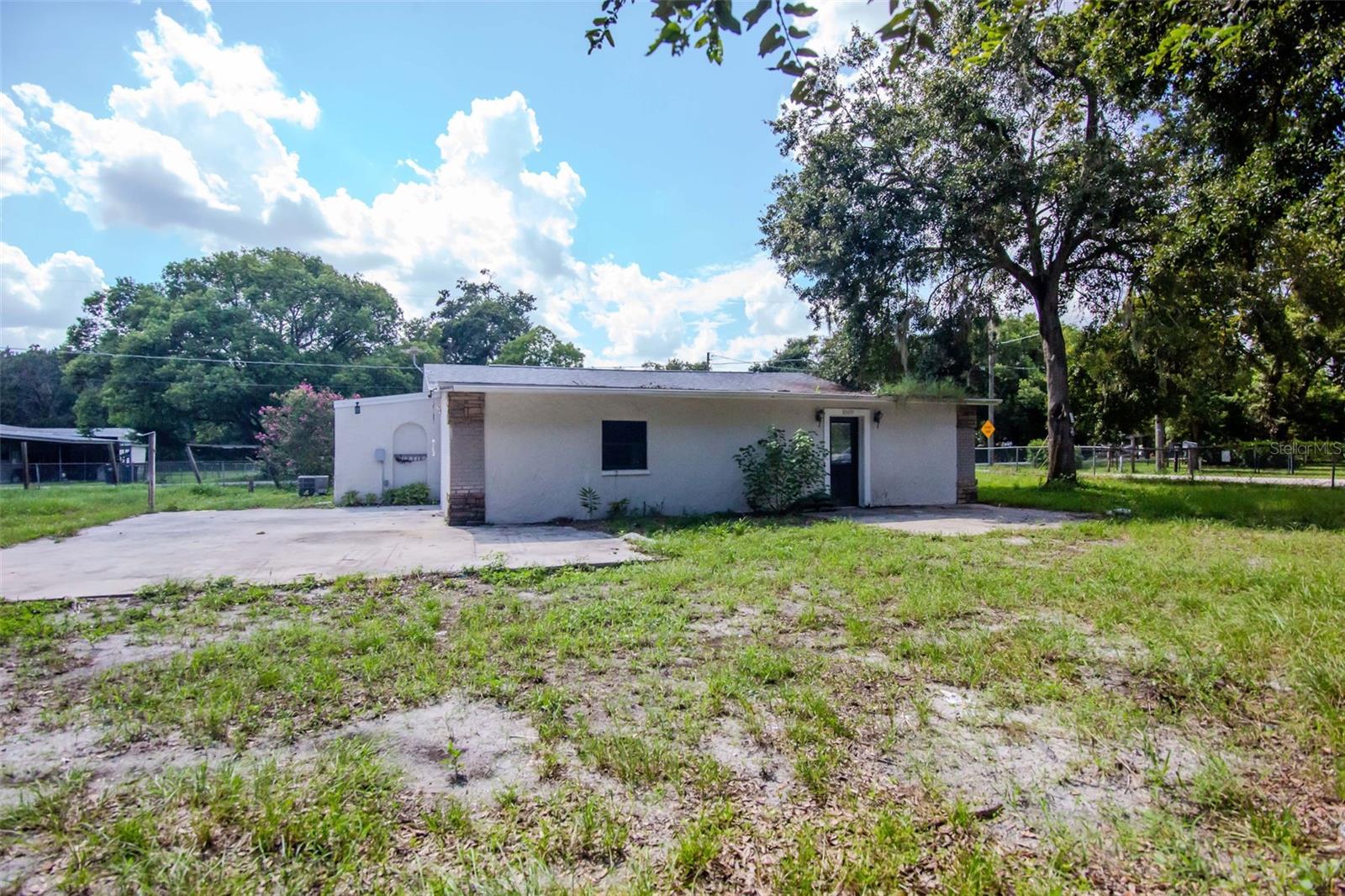 Charming 3-Bedroom, 1.5-Bath Home on Spacious .53-Acre Lot. Located in the heart of Plant City, this cozy home sits on a fully fenced, oversized lot with no HOA or deed restrictions—perfect for those who enjoy freedom and space. With a large backyard, there's plenty of room for all your toys, including boats, RVs, and more! Inside, you’ll find a bright, open layout featuring a spacious kitchen and living room, ideal for family gatherings and entertaining. The primary bedroom boasts a generous walk-in closet, providing ample storage space. The inside laundry room adds extra convenience for everyday living. Step outside to an expansive patio, perfect for hosting friends and family or simply relaxing outdoors.
With easy access to Interstate 4, schools, shopping, and local amenities, this home is perfectly located for convenience and accessibility.