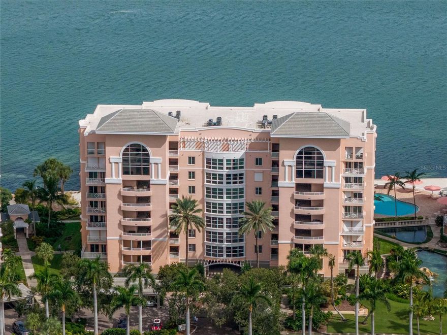 Welcome to this exceptional three-bedroom, two-bath waterfront residence in the gated Bacopa Bay community —where refined design meets resort-style living. Thoughtfully remodeled and infused with coastal elegance, this 1,868-square-foot condominium showcases panoramic views of Boca Ciega Bay, the community’s private beach, and its lushly landscaped lagoon.Inside, an open-concept layout floods the home with natural light, connecting seamlessly to two expansive verandas—perfect for relaxing, dining, or taking in the vibrant sunset vistas over the bay. The primary suite is a serene retreat featuring tranquil water views, direct veranda access, a custom walk-in closet,  and a spa-inspired ensuite bath.The gourmet kitchen is both stylish and functional, with granite countertops, updated stainless-steel appliances, and a generous breakfast bar ideal for entertaining. A split-bedroom plan ensures privacy, with a spacious guest suite and a beautifully updated bath. The versatile third bedroom offers flexibility as a guest space, home office, or private sanctuary—complete with its own veranda overlooking the pond. Additional features include new hurricane-rated windows and sliders, updated HVAC and water heater, and reserved garage parking.  Bacopa Bay delivers an unparalleled resort-inspired lifestyle with 24-hour guard-gated security and a wealth of amenities: two heated pools (including a 25-meter lap pool), a jetted hot tub, private beach, fitness center, clubhouse, lighted Har-Tru tennis courts, walking paths, EV charging, and car wash stations. The community has recently completed major upgrades—including new roofs, elevators, landscaping, seawall replacement, and roadway improvements—and has passed Florida’s milestone engineering inspections.  Ideally located less than 10 minutes from downtown St. Petersburg, the Gulf beaches, and Fort De Soto Park, Bacopa Bay offers a rare combination of tranquil waterfront living and urban convenience—just 30 minutes to Tampa International Airport.