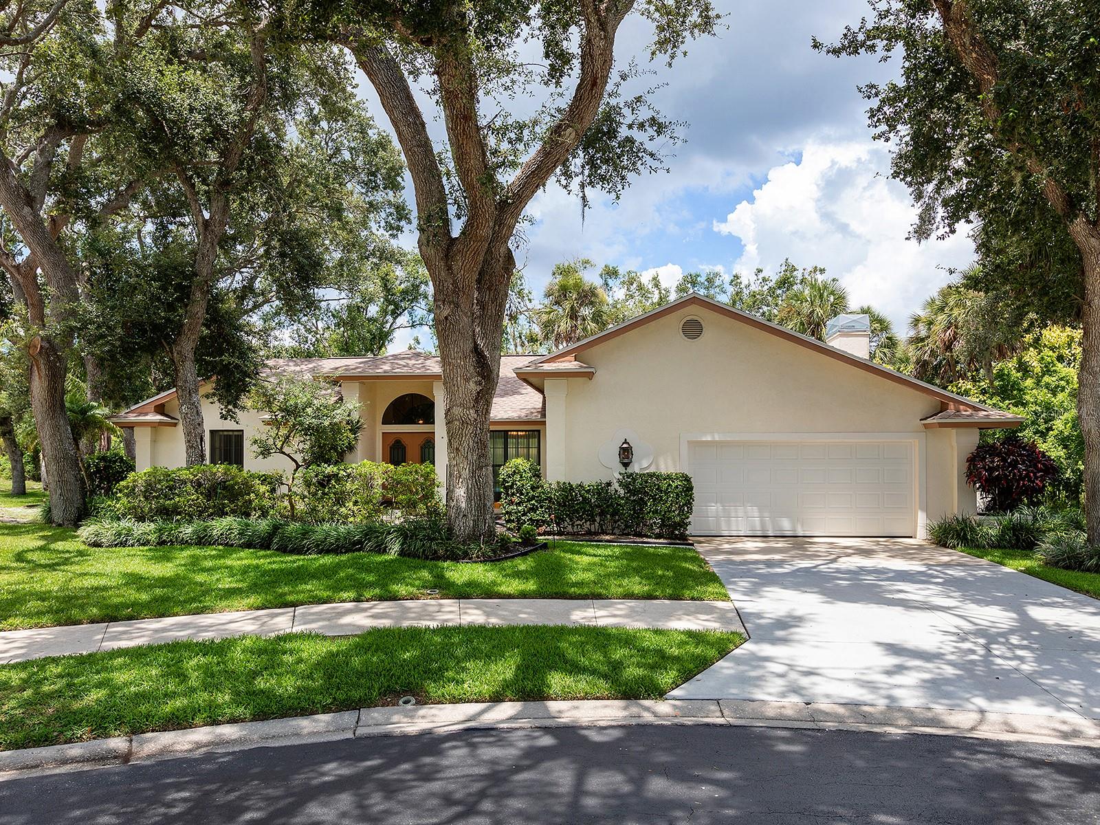 Welcome to this beautifully maintained residence, nestled in a quiet cul-de-sac within the desirable and centrally located Lake Estates community. Offered by its original owner and on the market for the very first time, this home exudes pride of ownership and timeless charm. As you step inside, you're greeted by elevated ceilings and expansive 10-foot sliding glass doors that frame a tranquil, landscaped backdrop, creating a seamless connection between indoor and outdoor living. The inviting curb appeal sets the tone for what continues throughout the home. Designed with a spacious split floor plan, the layout offers both functionality and flow, ideal for relaxed family living or refined entertaining. The primary suite, completely remodeled in 2023, offers a tranquil and stylish retreat. Thoughtfully designed, it features luxury vinyl plank flooring, dual closets, and direct access to the pool. The en-suite bathroom is a true highlight, showcasing modern finishes including white shaker vanities, dual sinks, and sleek quartz countertops, bringing spa-like comfort to your everyday routine. Major updates bring peace of mind and efficiency, including a new roof installed in 2023 and added roof insulation for year-round comfort. An oversized garage features a hurricane-rated garage door, installed in 2024, and LEXAN window shutters (added in 2006) provide enhanced storm protection without compromising natural light. Step outside to your private backyard oasis, where a refinished pool (2019) invites you to unwind, entertain, and enjoy the very best of Florida living. Whether it’s quiet mornings by the lake or vibrant evenings by the pool, this outdoor space makes every day feel like a vacation. Residents of Lake Estates enjoy access to a community recreational area featuring a swimming pool, basketball court, tennis courts, perfect for active lifestyles and social gatherings.