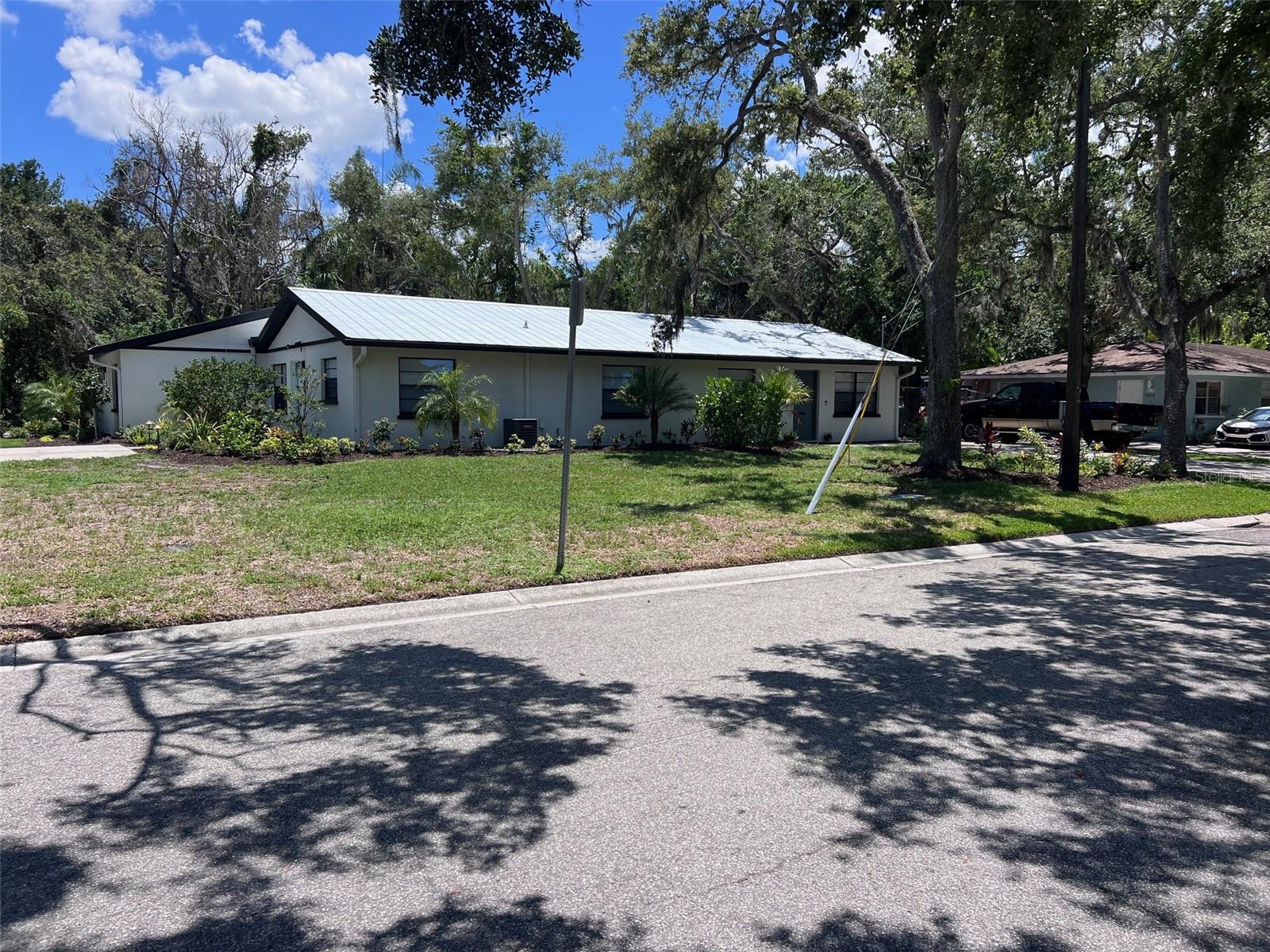 Prime investment opportunity in the heart of Bradenton. This fully renovated triplex, just steps from the scenic Manatee River, offers strong rental potential with no CDD or HOA. Each of the three 2-bedroom, 1-bathroom units features separate entrances and individual utility meters, ensuring tenant convenience and owner flexibility. Two units come turn-key furnished, ready for immediate occupancy or rental.
Recent upgrades include new electrical panels (2024), stainless steel appliances (2023-2024), modern cabinets (2023-2024), sleek quartz counters (2023-2024), tile flooring (2024), a durable metal roof (2022), and fresh interior/exterior paint (2023). Each unit boasts private porches with convenient laundry facilities, adding to the property’s appeal.
Perfect for investors or owner-occupants, this triplex is strategically located with easy access to I-75, Lakewood Ranch, and Sarasota, just 30 minutes from Anna Maria Island’s pristine beaches, and minutes from downtown Bradenton’s vibrant restaurants, shopping, and boat launch, minutes from the Riverwalk. Minimal prior income history due to the remodel, but this beautifully updated property is poised to generate revenue. Schedule your private showing today and seize this exceptional opportunity!
