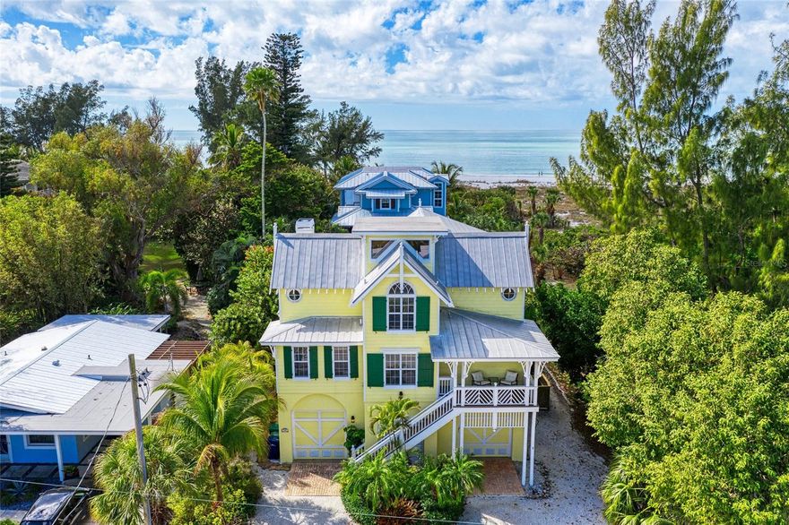 Stunning Family Vacation Home in Anna Maria, FL!  Yellowbird, 705 North Shore Dr., Anna Maria.  Nestled on the beautiful North End of Anna Maria Island, Yellowbird is a luxurious family vacation home that embodies old Florida charm and offers an ideal location just a quick stroll from the stunning white sandy beach. This spacious retreat features 4 bedrooms and 3.5 bathrooms, providing the perfect haven for family gatherings. Accommodating everyone comfortably, the sleeping arrangements include 2 bedrooms with king beds, 1 Queen bedroom, 1 bedroom with a Queen Murphy bed and a bonus loft with 1 Full, and 1 Twin Trundle bed.  As you enter, you’ll be greeted by an expansive, modern kitchen that has been totally remodeled with new cabinets and appliances. This open-air concept is designed for creating lasting family memories, with ample seating for large gatherings, including dining options around the new beautiful island in the kitchen.  The inviting family room serves as the perfect spot for game nights or movie marathons, complete with a 55-inch Smart TV.  Step outside to discover an outdoor paradise, where you can relax by the resurfaced private heated pool, illuminated with LED lights. Surrounded by new limestone pavers, the pool area features an outdoor shower and a dedicated game room with a ping pong table. The updated tropical tiki bar and comfortable seating create an idyllic atmosphere for unwinding all day or to cool off after a perfect day at the beaches of the Gulf of Mexico. Multiple decks and verandahs offer breathtaking sunset views, making every evening a memorable experience.  Convenience is key at Yellowbird, highlighted by an elevator from the garage to the 2nd floor, a laundry room with a washer and dryer.  Each bedroom is equipped with Smart TVs and ceiling fans, ensuring comfort for every guest. The master bedroom, located on the main living area, includes a custom walk-in closet and private deck access overlooking the pool, while the third floor features three additional inviting bedrooms, including a king bedroom with an en-suite bathroom, a queen bedroom, and a room with a queen Murphy bed. Kids will enjoy the loft area on the top floor, featuring a full bed and twin trundle, accessed via a ladder.  With 3 driveway spaces and 2 garages equipped with door openers and remotes, parking is never a concern.  Yellowbird is not just a home; it’s your very own retreat where morning coffee on the deck and sunset views become a part of your daily routine. Located within easy walking distance to shops, restaurants, and the free island trolley, you can explore the vibrant charm of Anna Maria Island at your leisure.  Your dream beach vacation home awaits at Yellowbird—come and experience the magic for yourself and start living your Anna Maria Life.