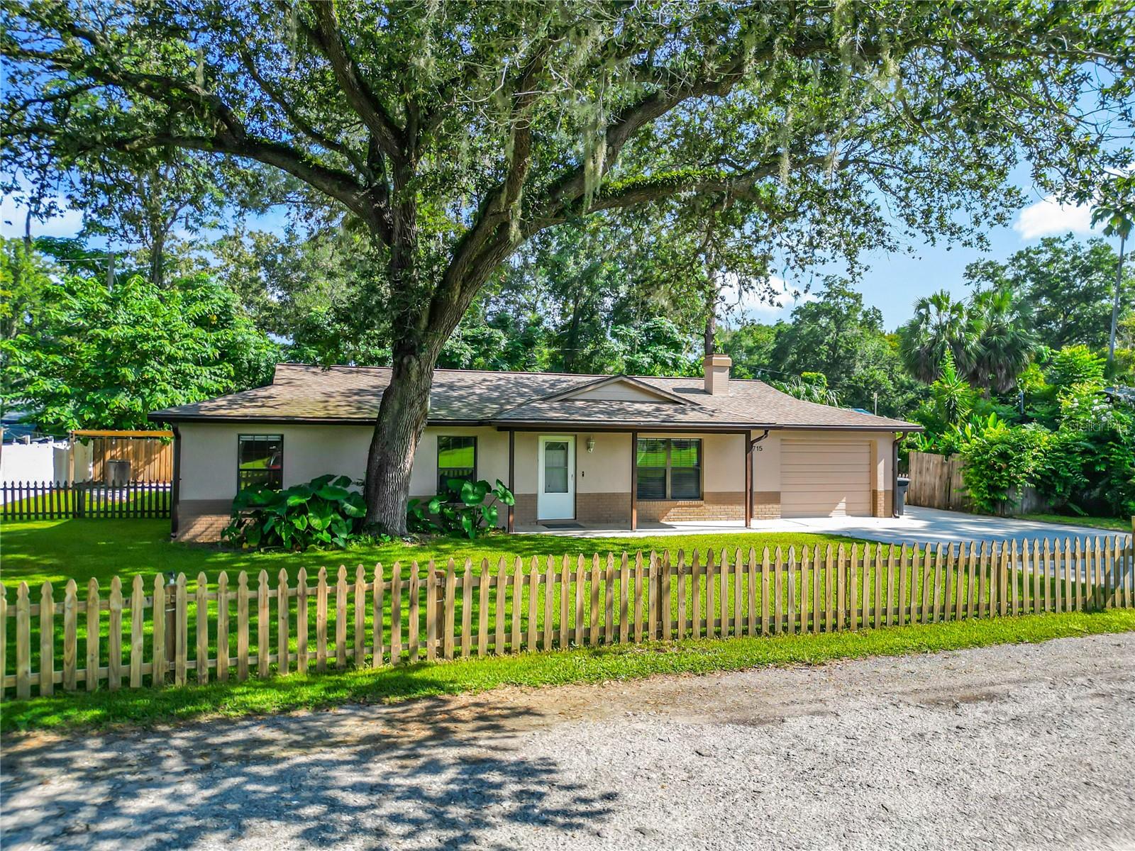 Move-In Ready Home in Southeast Ocala! Located in an established neighborhood, this spacious 3 bedroom, 2 bathroom home offers 1,833 sq. ft. of living space under air plus multiple living areas including a living room, family room, and bonus room, plenty of space for entertaining, work, or play. The kitchen has been beautifully updated with granite countertops, new cabinetry, and stainless steel Whirlpool appliances, and flows seamlessly into the living spaces. The cozy wood-burning fireplace with white-washed brick surround and floating shelves is the perfect spot to mount a flat screen and gather with family.
Additional highlights include:
- Fully renovated master bath
- LVP flooring throughout
- Washer & dryer included
- Reroof (2013) & new A/C (2020) for peace of mind
- Fresh exterior paint for great curb appeal
Enjoy mornings on the front porch or relax in the screened lanai overlooking the backyard. A 12x12 storage shed and 12x15 lean-to with concrete pad provide excellent storage and workshop options. This home combines charm, updates, and functionality in a desirable Southeast Ocala location, don’t miss your chance to make it yours!