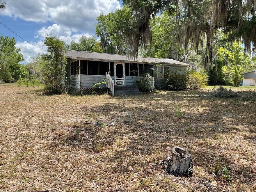 Escape to your own private oasis in the heart of the Ocala National Forest! This charming 2-bedroom, 2-bathroom home is nestled on nearly a full acre of serene, wooded land in this quiet rural community. Whether you're seeking a peaceful primary residence or a weekend getaway, you'll love being within walking distance of the community boat ramp to the Ocklawaha River. Spend your days fishing the world-famous Rodman Recreation Area, hiking the Florida Trail, or exploring the countless springs nearby. With a garage / workshop  for all your gear, this is the ultimate home base for outdoor enthusiasts! Or this could be an amazing investment opportunity with the extra .38 of an acre connected lot in Fort McCoy! This solid 1,064 sq. ft. block home at 24642 NE 177th Ter offers incredible potential for the savvy buyer. Situated on a spacious 0.96-acre lot with no HOA fees, there is plenty of room for expansion, gardening, or storing your boat and RV. The property features a detached building, perfect for a workshop or extra storage. Located just minutes from Salt Springs and Silver Springs, this classic is ready for your personal touch. Homes in this area with river access are rare—don't miss out on this high-value lot and location!