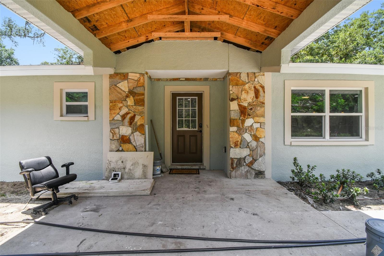 This beautifully remodeled single-family home offers the perfect blend of privacy and convenience, situated on nearly 3 acres of cleared land at the end of a quiet cul-de-sac. Accessed by a private road, the property provides a peaceful retreat just 15 minutes from the center of town, casino, shopping center, movies, theaters, Port Ybor City, and Downtown Tampa, airport, etc. The home has been fully renovated from top to bottom, featuring luxury vinyl flooring, stainless steel appliances, wood cabinetry, and elegant quartz countertops. With a spacious two-car garage and a freshly cleaned lot, this property is move-in ready and ideal for those seeking space, style, and proximity to urban amenities.