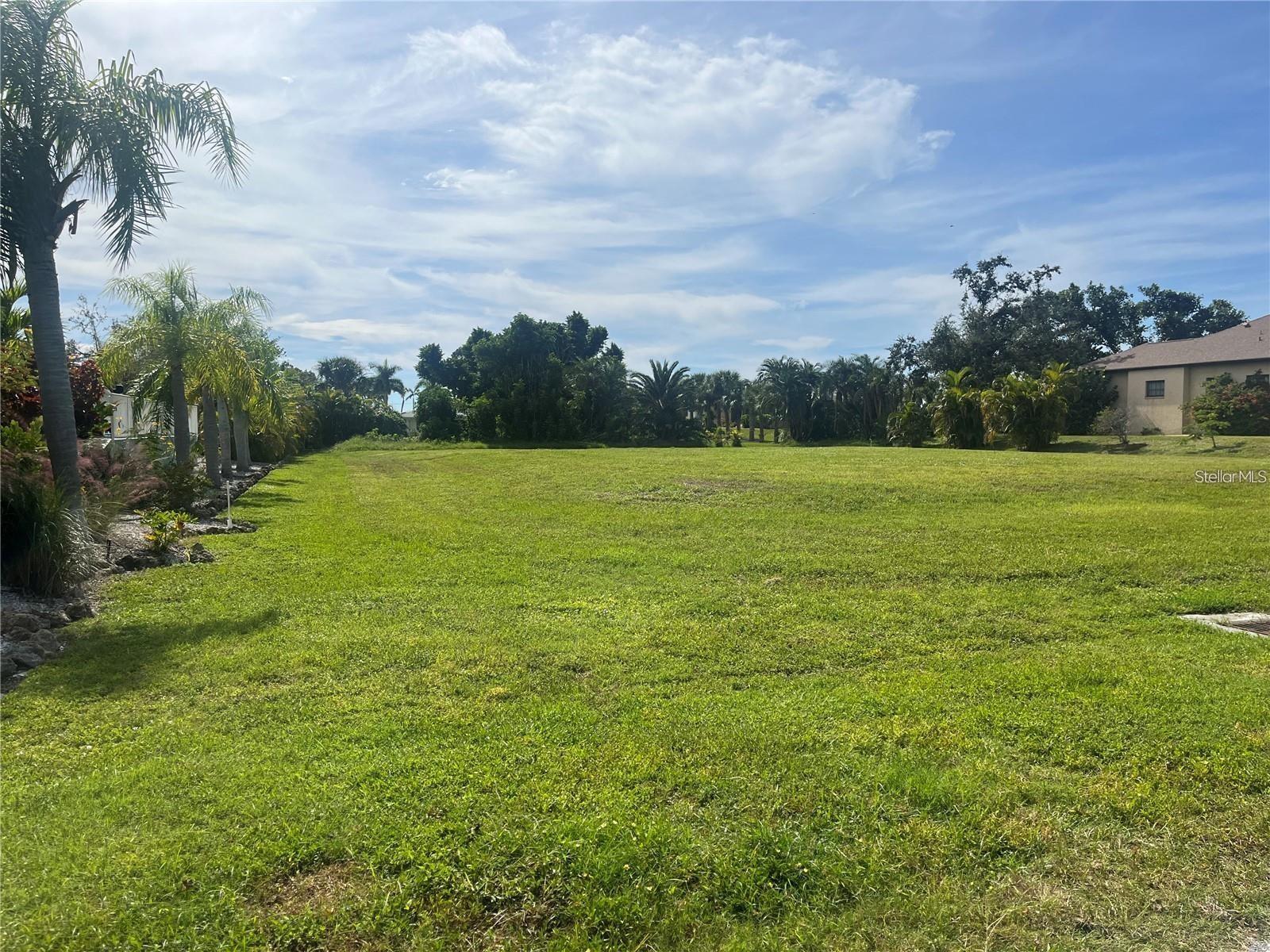 Half acre cleared building Lot in the beautiful subdivision of Cape Haze! More precisely this large 25,734 sq ft lot is located on the tiny island section of Cape Haze! It has 126' of street frontage and approx. 204' deep (front to back lot line) Drive through Cape Haze very slowly and appreciate the beauty of the huge old mighty BANYAN trees that in some areas form a gorgeous canopy!! ….You will also enjoy the beautiful sub-tropical gentle winds coming off of the intracoastal. Restaurants, grocery stores, Marinas and beautiful beaches of Boca Grande, Manasota Key are minutes away.