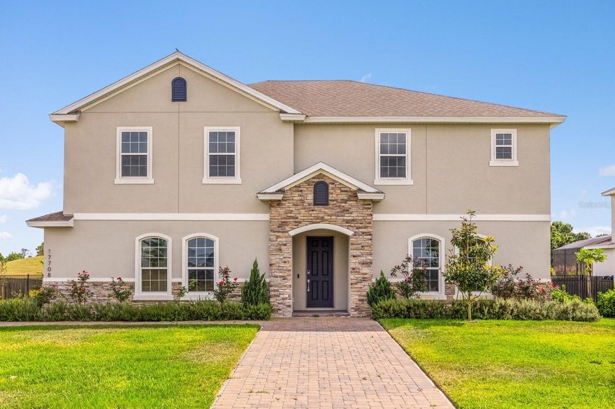 Welcome to 17708 Sawgrass Run, a stunning 2023-built luxury home located in the exclusive Deer Island community. This five-bedroom, three full and two half bath residence combines modern design, thoughtful upgrades, and breathtaking golf course views for the ultimate Florida lifestyle. Perfectly positioned at the end of a quiet street on a 0.26-acre lot, this home offers both privacy and elegance.

Step inside to an open-concept floor plan centered around a true chef’s kitchen featuring an oversized quartz island, wall oven and microwave, pot filler, family-size refrigerator with auto-fill pitcher, farmhouse sink with digital Kraus faucet, and a custom double-size pantry. The spacious living and dining areas flow seamlessly into a spectacular 1,040-square-foot Mandara-style panoramic enclosure with wider aluminum columns that provide unobstructed fairway views—an elevated upgrade compared to standard enclosures.

The first floor includes a bright guest suite with full bath and walk-in closet, while upstairs, the expansive primary suite offers custom-built closets and a beautifully appointed bath. Additional family and flex spaces add comfort and versatility. Premium finishes throughout include modern wood stairs with a two-inch stainless steel handrail, wood and Italian porcelain flooring (no laminate or vinyl), a modern ceiling fan with built-in speaker, and a laundry room with wood cabinetry and granite countertops.

Exterior features include a two-car garage with an extended driveway for up to six vehicles and a well-fed irrigation system with filtration.

Deer Island is a private, gated island community surrounded by Lakes Dora and Beauclair, featuring an 18-hole championship golf course with a brand-new full-service restaurant. Ideally located just minutes from Mount Dora and downtown Tavares, this home offers the perfect blend of tranquility, luxury, and convenience.

Experience modern elegance, panoramic views, and exceptional living. Schedule your private showing today.