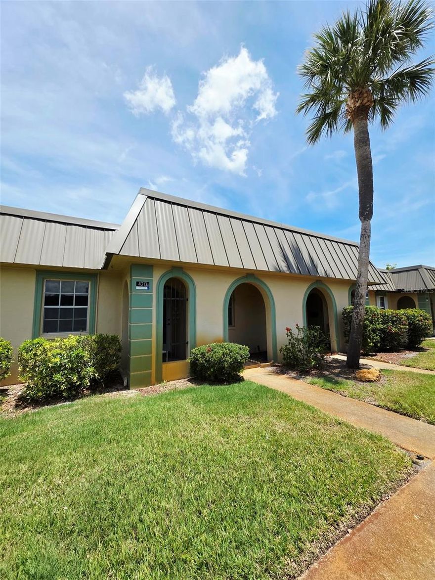 Discover the ultimate Florida lifestyle in this freshly renovated, move-in-ready 2-bedroom, 1-bathroom condo located in the heart of the gated 55+ community, The Gardens of Beacon Square. Every detail of this residence has been addressed, from the kitchen featuring brand-new cabinetry and appliances to the fresh interior paint and a newly installed water heater. Sophisticated tile flooring flows seamlessly throughout the entire space, reflecting the natural light that pours into this fantastic unit. Backing up to mature foliage just yards from a water view, the home offers a unique dual-aspect experience where you can enjoy serene sunrises from your rear patio or catch glowing sunsets from your front porch and kitchen window.
Designed for effortless living, this turn-key retreat combines practicality with resort-style comfort. Your assigned covered parking is located just steps from your door, ensuring convenience as you transition into a lifestyle that feels like a year-round vacation. The manicured community grounds offer a sparkling pool, shuffleboard courts, and a social center complete with a library and a full event calendar. This low-maintenance experience is further enhanced by a comprehensive $686 monthly fee that covers water, sewer, trash, cable, high-speed internet, exterior maintenance, and all community amenities including insurance.
Beyond the gates, you are perfectly positioned to enjoy the best of the Gulf Coast. You are only minutes away from the vibrant dining, historic theaters, and waterfront parks of downtown New Port Richey, with pristine Gulf beaches just a short drive away. With easy access to the expressway, world-renowned amusement parks, international airports, and major sporting arenas are all within reach. This exceptionally priced opportunity offers a coastal retreat in the center of it all. Schedule your showing today before it's gone!