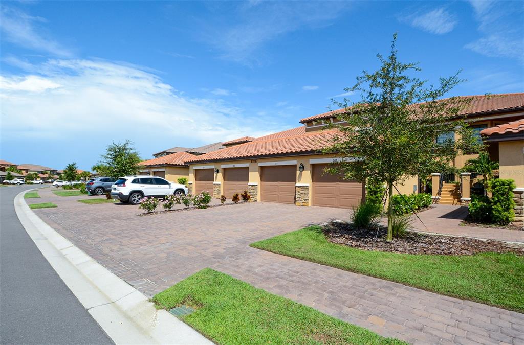 BOOKED FOR JAN-MAR 2026. AVAILABLE ALL OFF SEASON MONTHS. Welcome to the Gated Community of Esplanade at Lakewood Ranch! This tastefully furnished 2nd floor 2BR/BA condo is situated on Esplanade's Championship Golf Course. As you walk up the exterior stairs to your private outdoor seating area, you will then enter through the front door and will be met by a bright and open spacious split floor plan with vaulted ceilings, a fully equipped kitchen with stainless steel appliances, granite counters and breakfast area with seating for 4. Leading from the kitchen is the living/dining area, a cozy den with a sleeper sofa and two armchairs. Off the living room is the master bedroom featuring a king-size bed, dresser and side tables, plus a tv, and an ensuite bathroom with a walk-in shower, dual vanities, and a walk-in closet. At the opposite end of the unit is the second bedroom, furnished with a queen size bed, and is located next to the guest bathroom with a single vanity and tub/shower combo. Relax on the furnished screened in balcony with new outdoor furniture and a mounted tv, sip on your morning coffee whilst watching the golfers play or enjoy an evening cocktail as you watch the sunset. This unit also comes with a one car garage which is available for your use during your stay. Enjoy all the Resort Style Amenities, 18 Hole Championship Golf Course, Lagoon Style Pool & Spa with Private Cabanas, Pool Side Bahama Bar, Resistance Pool, 2 Fitness Centers, Formal Dining in the Club Restaurant with Bar Overlooking Golf Course, Pizza Kitchen, Tennis Courts, Bocce Ball, Pickle Ball and much more! Membership Transfer fee is $250/person with $100 processing fee and a separate condo association application fee of $150. Nearby access to I-75, a short drive to UTC Mall where there is an abundance of shopping and dining choices. Take a short drive to the beautiful gulf coast beaches of Anna Maria Island