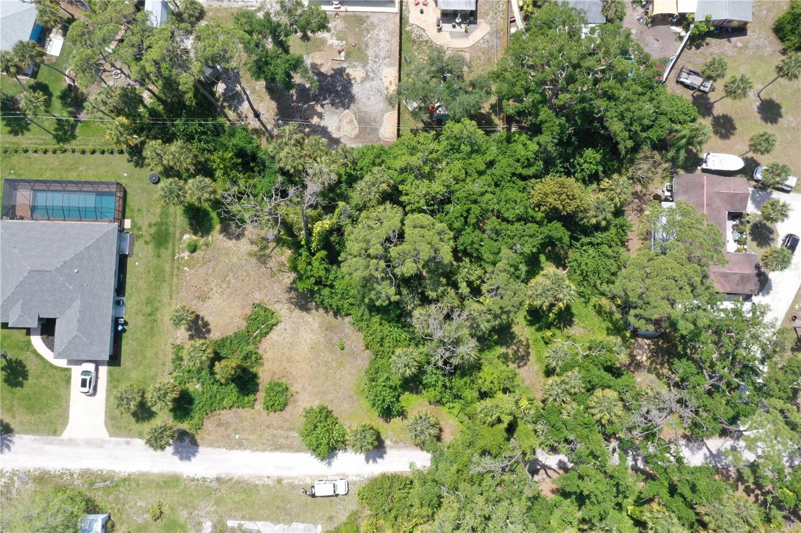 Here is your chance to build your dream home on a double lot that sits on a private dirt road in the heart of Englewood. Enjoy the quiet and peaceful atmosphere surrounded by natural Florida greenery while being within close proximity of Englewood's attractions, including Manasota Key and the shops on Dearborn St. Let your imagination run wild!!