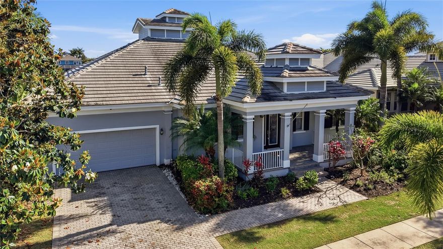 Welcome to resort-style living in MiraBay, the area’s premier gated waterfront community. This distinctive coastal residence—the only one of its kind in the neighborhood—offers nearly 3,500 sq ft of elegant living along a tranquil 135-acre lagoon with direct access to Tampa Bay. Featuring 4 bedrooms, 3.5 baths, a bonus room, a private dock with a newly rewired lift, and a private boat lift, this home is designed for refined indoor/outdoor living.

A brick paver driveway and welcoming front porch lead into a foyer with immediate lagoon views. To the left, a formal dining room with a tray ceiling flows to the fully remodeled kitchen and large walk-in pantry. The kitchen showcases quartz countertops with a waterfall edge, Sub-Zero refrigerator, custom island with butcher-block, gas cooktop, built-in espresso machine, and designer backsplash. The kitchen opens to the family room and breakfast nook, both sliding wide to the lanai for seamless entertaining.

The expansive lanai is an outdoor oasis: gas fireplace, outdoor kitchen, and a heated pebble-tec saltwater pool and spa framed by sweeping lagoon vistas. Lush landscaping and papaya tree—complete the private waterfront setting.

The primary suite is a serene retreat with lanai access and panoramic lagoon views. Dual walk-in closets lead to a spa-like bath featuring a large tile shower with dual rainfall heads and a freestanding soaking tub. Two bedrooms share a Jack-and-Jill bath at the front of the home; a fourth bedroom and flexible bonus room—accessed past the breakfast nook—share a bath. The bonus room’s pocket slider opens to the lanai and can serve as a home office, gym, or media room. Additional conveniences include a half bath, large storage closet near the foyer, and a two-car garage.

Notable updates and systems: new luxury vinyl flooring, refreshed garage flooring with overhead storage, two HVAC units with Nest thermostats, plantation shutters, tankless water heater, electric shades, Hayward pool heater with variable-speed pump, and fresh interior paint.

MiraBay amenities—at just $227/year HOA—include a community pool with five lap lanes and water slide, splash pad, spa/sauna, fitness center with trainers, tennis courts with coaches, café/restaurant, childcare, basketball courts, kayak rentals, and more. Easy commutes to St. Petersburg, Sarasota and Tampa round out this exceptional coastal offering. Embrace waterfront living at its finest.