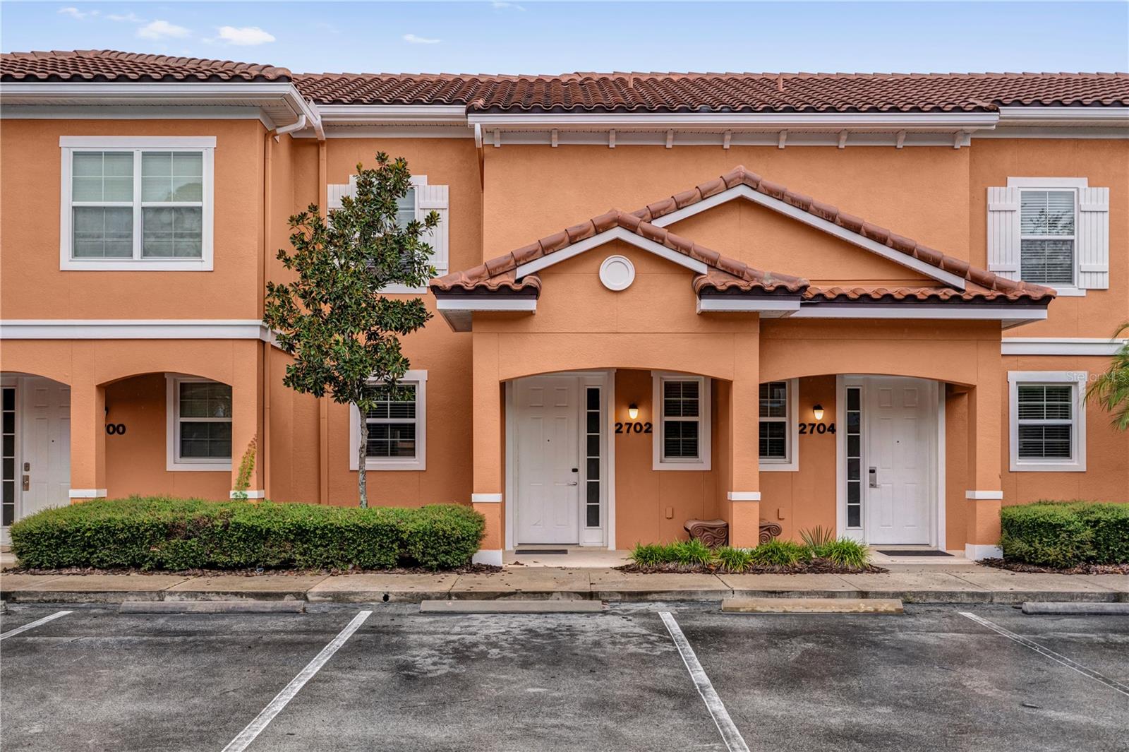 Located in the highly desirable Regal Oaks Resort, this stylishly furnished 2-bedroom, 2.5-bath townhome offers the perfect combination of comfort, convenience, and resort-style living. Just minutes from Disney and Orlando’s premier attractions, it’s an ideal choice for both vacationers and savvy investors.
Step inside to a bright, open-concept living and dining space designed for both relaxation and entertaining. The modern kitchen features stainless steel appliances, granite countertops, and generous cabinet storage. Sliding glass doors open to a private screened patio with a hot tub, where tranquil pond views create the ultimate outdoor retreat.
Upstairs, you’ll find two spacious bedrooms, each with its own en-suite bath for added privacy. The primary suite includes a spa-inspired bathroom, while the secondary bedroom provides a welcoming space for family or guests. A convenient half bath is located downstairs.
As part of the gated Regal Oaks community, residents enjoy access to an impressive array of amenities, including a lagoon-style pool with water slides, a clubhouse, fitness center, tennis courts, and an on-site restaurant and bar.
With its unbeatable location, resort amenities, and excellent rental potential, this property is a standout opportunity. Schedule your private showing today!