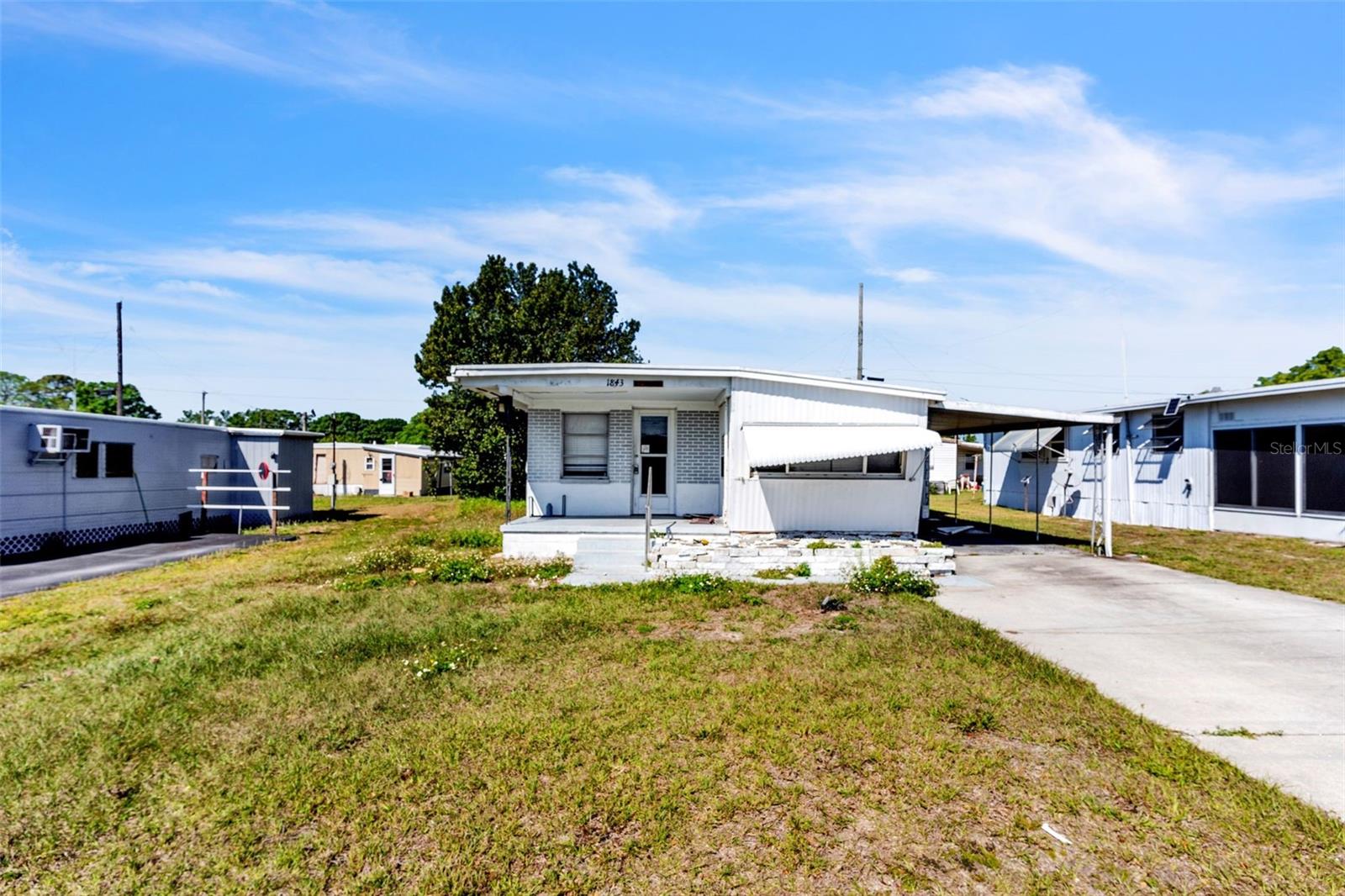 Back on market! Previous buyer not willing to wait until end of probate. Final orders are in and ready to close. Opportunity awaits at 1843 Hoyle Dr, Holiday! This 1-bedroom, 1-bathroom mobile home offers plenty of potential, with space to easily convert it into a 2-bedroom, 1-bathroom layout. The property needs a full renovation, making it the perfect blank slate for an investor or buyer looking to customize their home. While the home requires extensive work, no flood damage has been reported inside. Conveniently located in Holiday, this property provides easy access to shopping, dining, and major roadways. Buyer to verify all information.