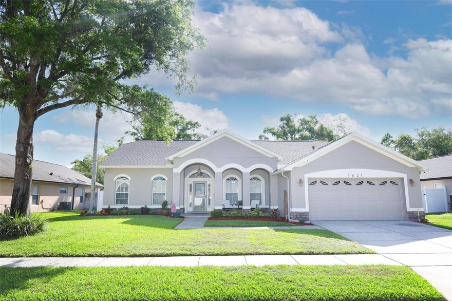 Come and take a look at this beautiful 3-bedroom, 2-bath pool home that’s move-in ready! This home features a stunning updated kitchen with granite countertops, fresh interior and exterior paint, and a cozy fireplace perfect for relaxing evenings. Enjoy the durability and style of wood and tile flooring throughout with visually appealing vaulted ceilings. Both bathrooms have been meticulously remodeled as well. New roof in 2023, water heater in 2021, pool deck in 2021and inside pool Resurface with pebble deck, screen 2022, converted to salt in 2023, House painted inside and outside in2025. Step outside to a screened-in porch overlooking your private pool—ideal for entertaining or unwinding year-round. A perfect blend of comfort, style, and Florida living!