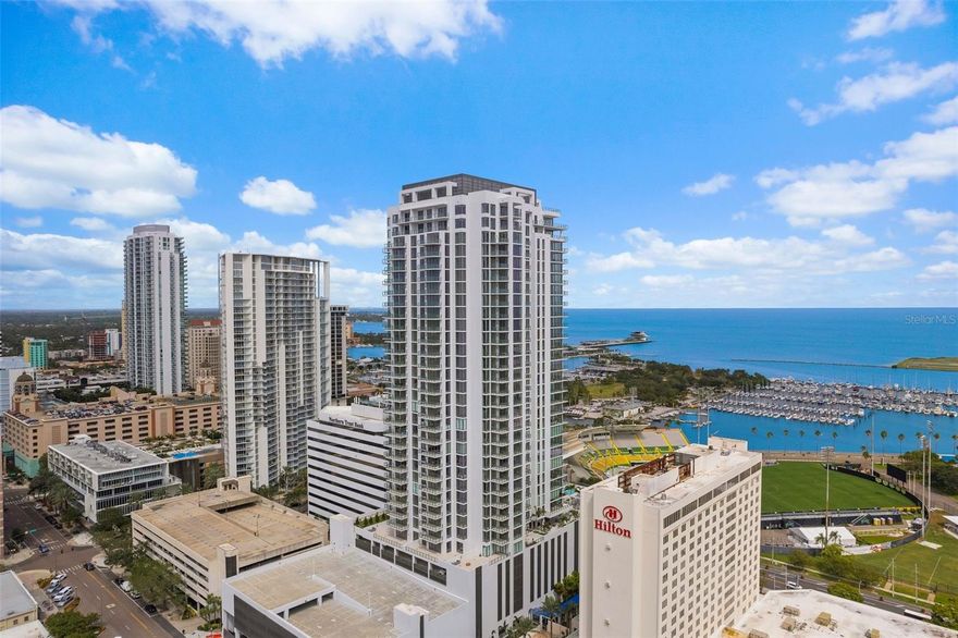 One or more photo(s) has been virtually staged. Welcome to luxury living at its finest! Saltaire!   This stunning three-bedroom, four-bathroom unit at 301 1st St. S. boasts an expansive 2,712 square feet of space, providing ample room for comfortable living and entertaining. The additional den offers flexibility for a home office, library, or cozy retreat. Enjoy the seamless blend of modern elegance and functionality throughout, featuring high-end finishes, sleek designs, and top-of-the-line Jenn-air appliances. Bask in the natural light pouring in from large windows, offering breathtaking views of Tampa Bay and beyond. With an additional 192 square feet of Terrace space to enjoy the views.  The building's amenities are unparalleled, offering a fitness center, concierge service, and a rooftop terrace with pool for relaxing and taking in the city's vibrant energy. Don't miss out on the chance to make this luxurious haven your new home.