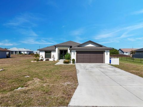 Photo of 633 Carrillon Avenue S, Lehigh Acres, FL 33974 (MLS # C7520996)